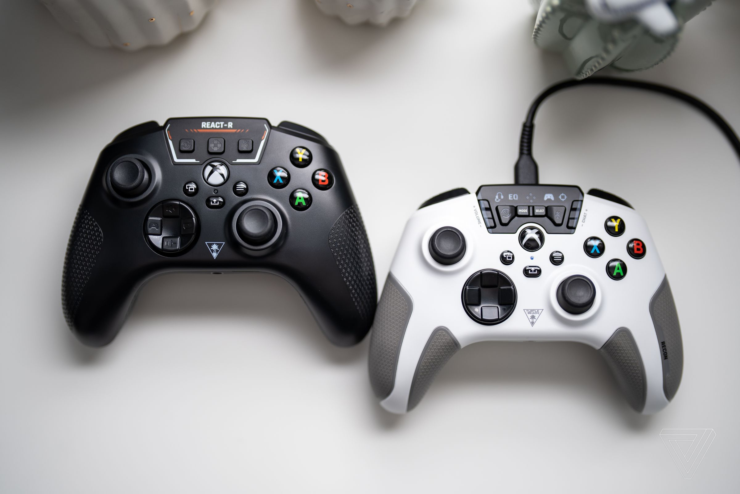 The Recon (right) is the more robust controller, but the new React-R (left) has much more streamlined controls.