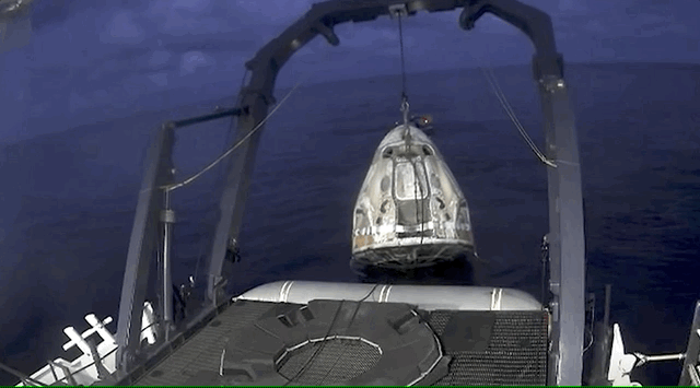 Crew Dragon is lifted from the water and placed in its “Dragon nest” — a small pad on SpaceX’s recovery vessel.
