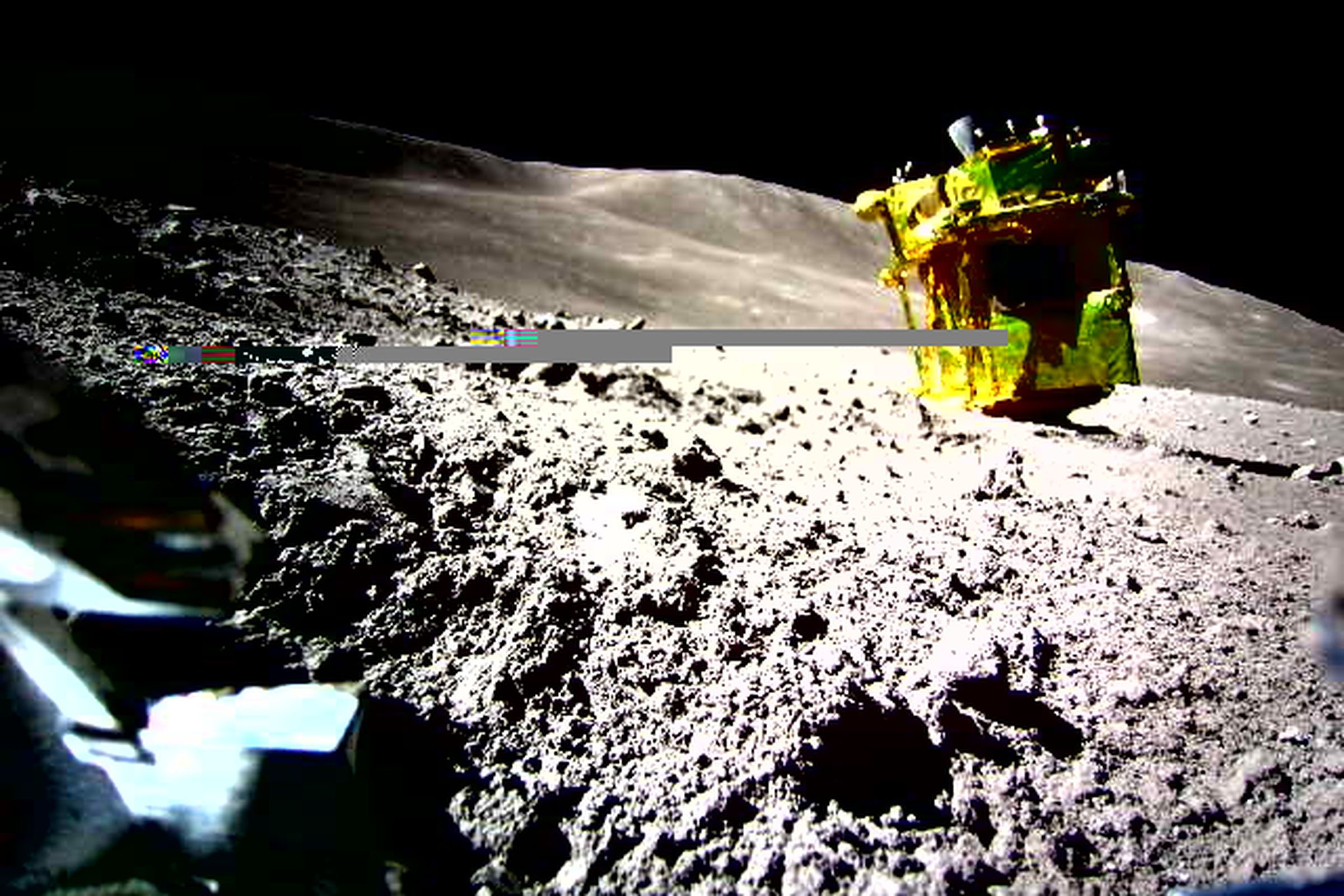 A photograph taken of the SLIM probe on the Moon’s surface by the LEV-2 robot.