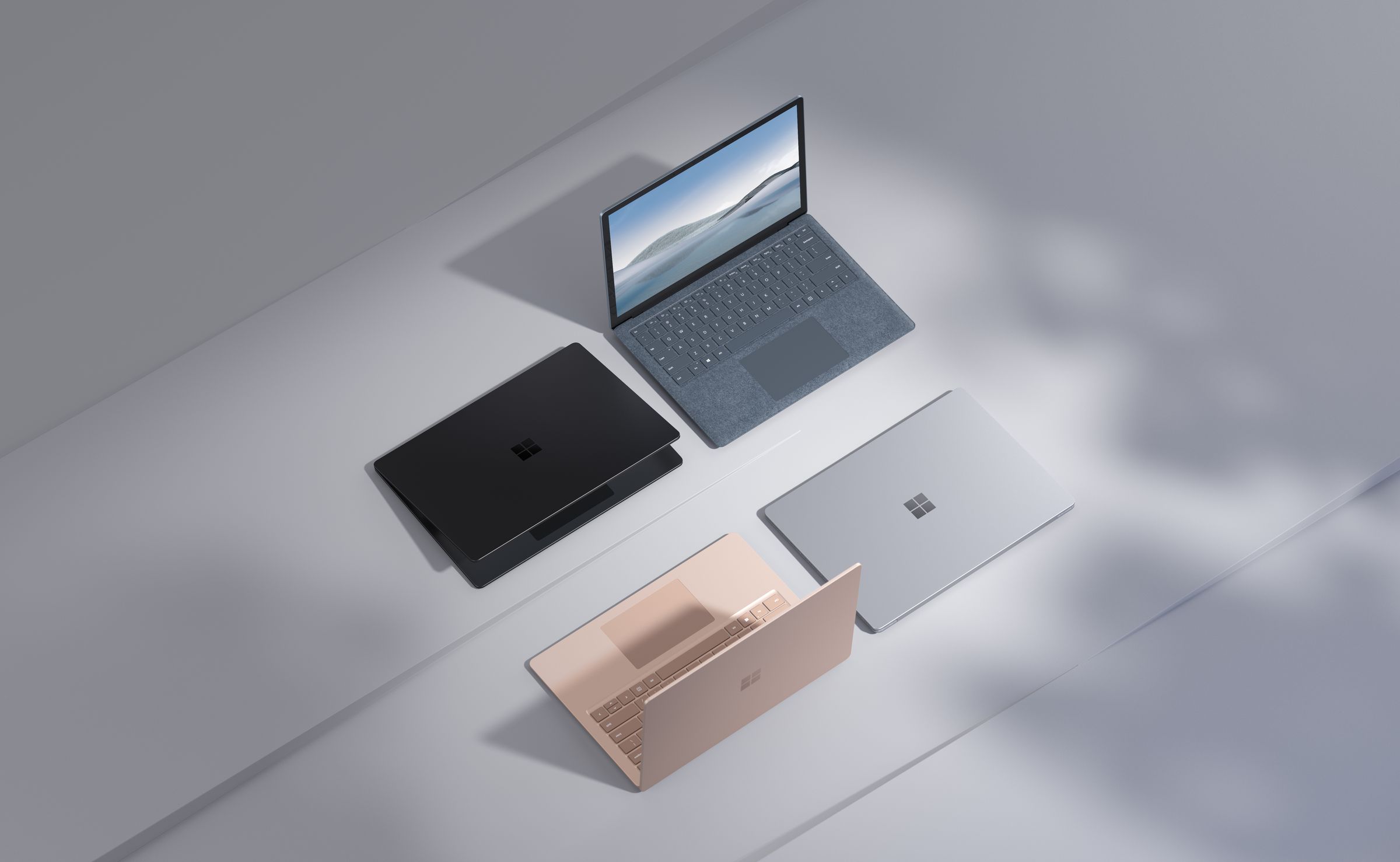 Four Microsoft Surface products in a variety of colors.