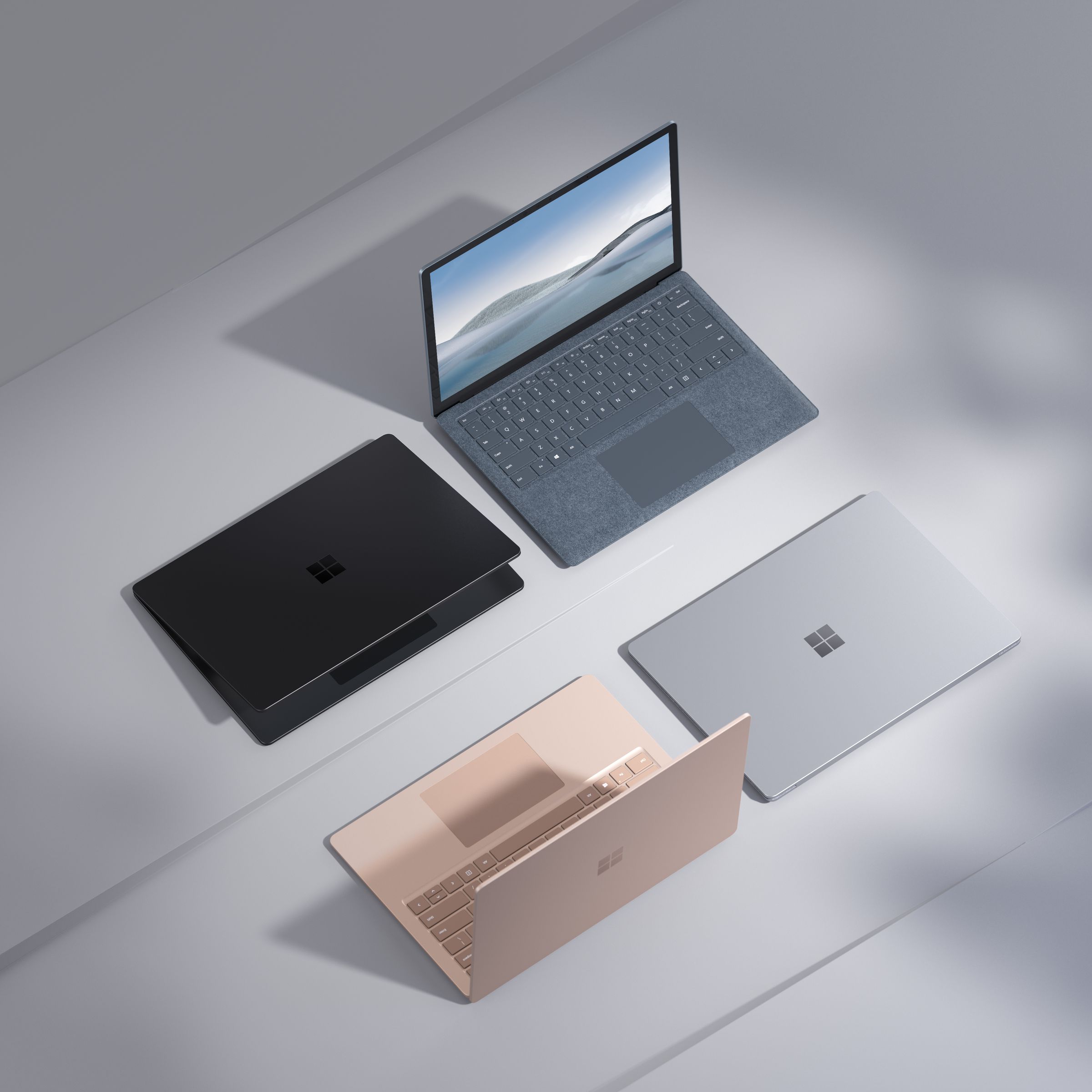Four Microsoft Surface products in a variety of colors.