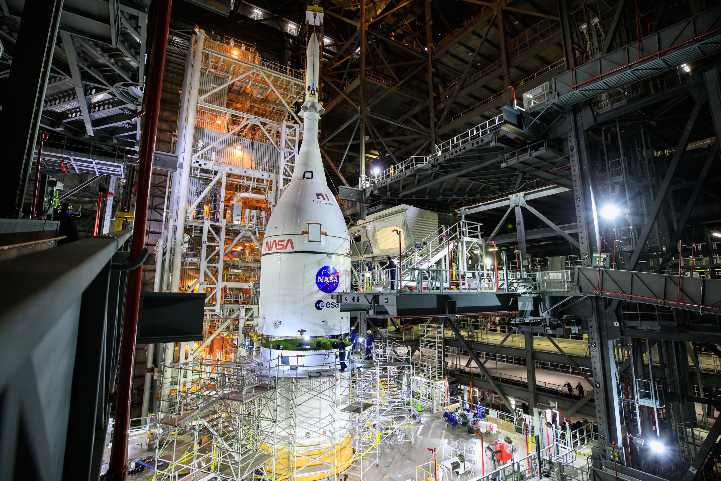 The Orion spacecraft for NASA’s Artemis I mission lifted above the Space Launch System at Kennedy Space Center