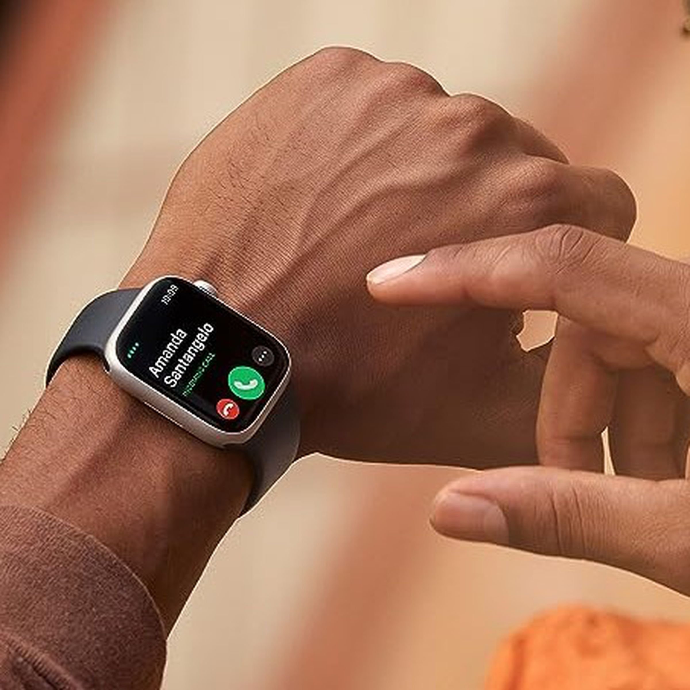A person wearing the Apple Watch Series 8 on their wrist.