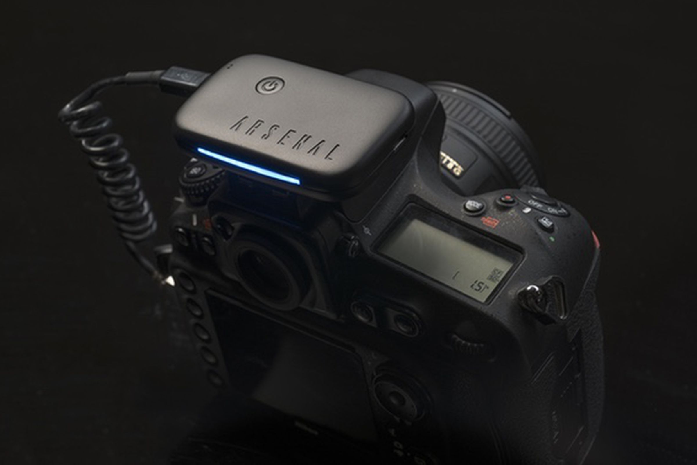 The Arsenal looks like a slim battery pack that clips onto the top of your DSLR camera. 