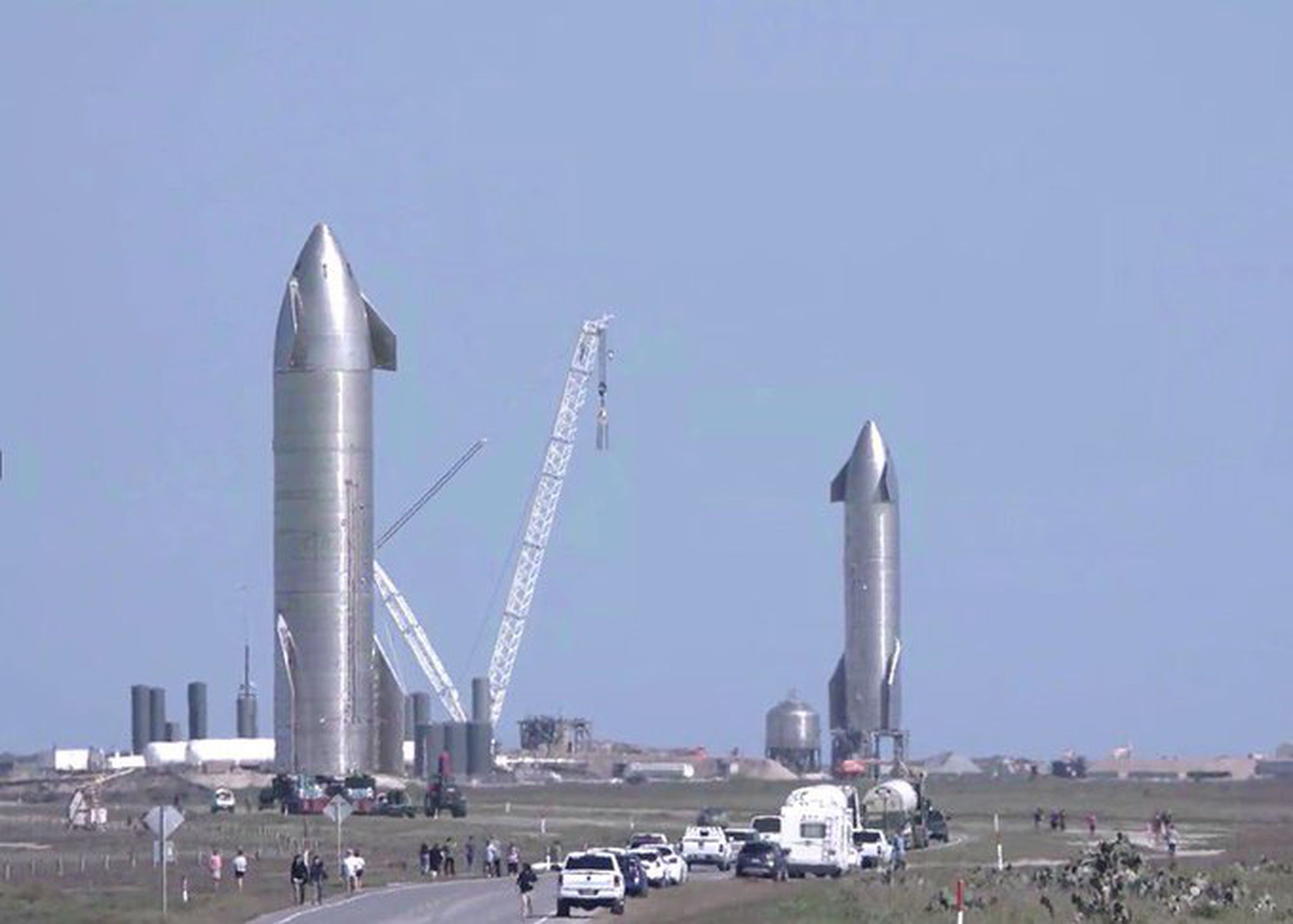 Two since-destroyed Starship prototypes stand at SpaceX’s Boca Chica, Texas Starship facilities.