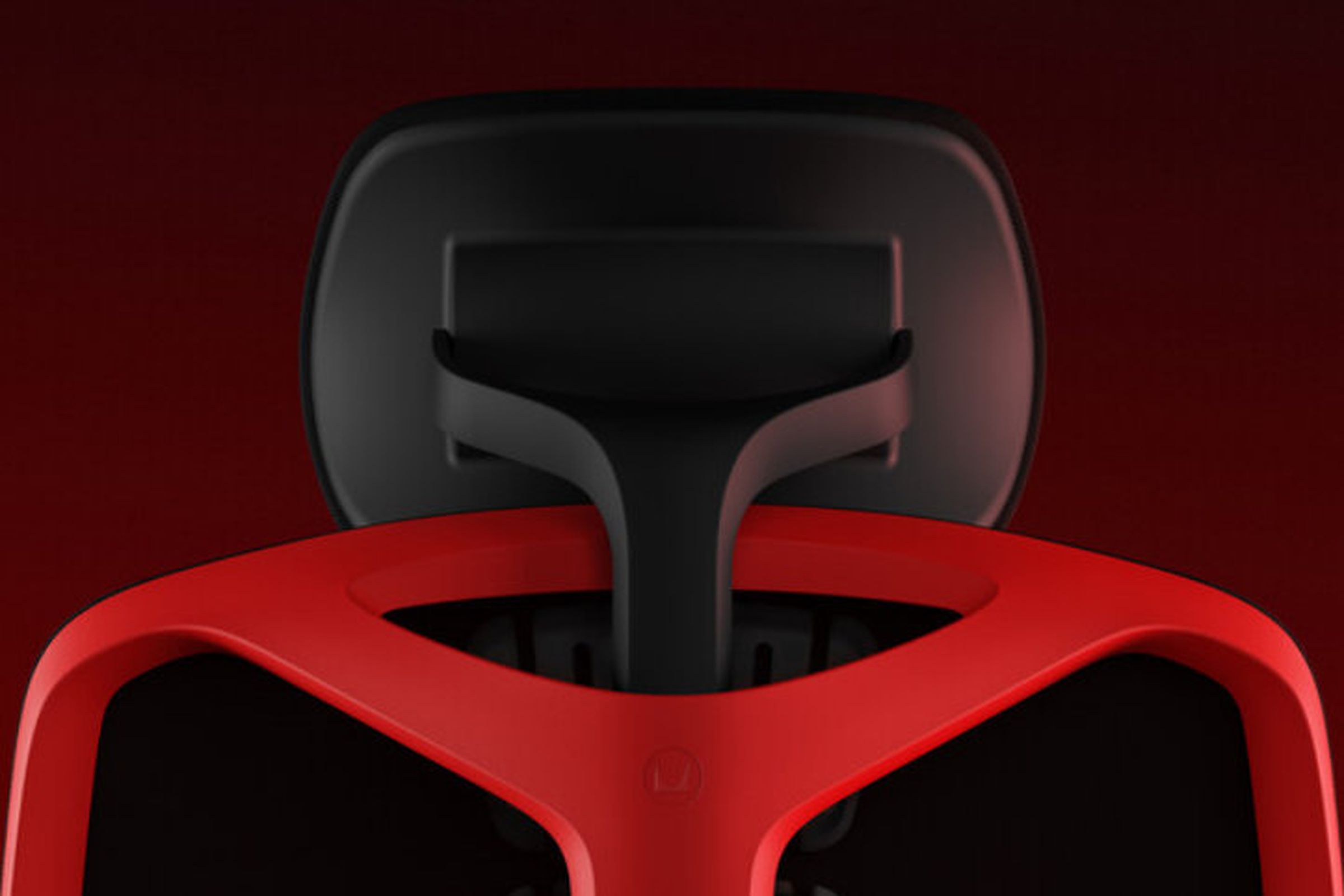 A picture showing the backside of the Herman Miller and Logitech Vantum gaming chair in red and black. It’s focused on the new adjustable headrest.