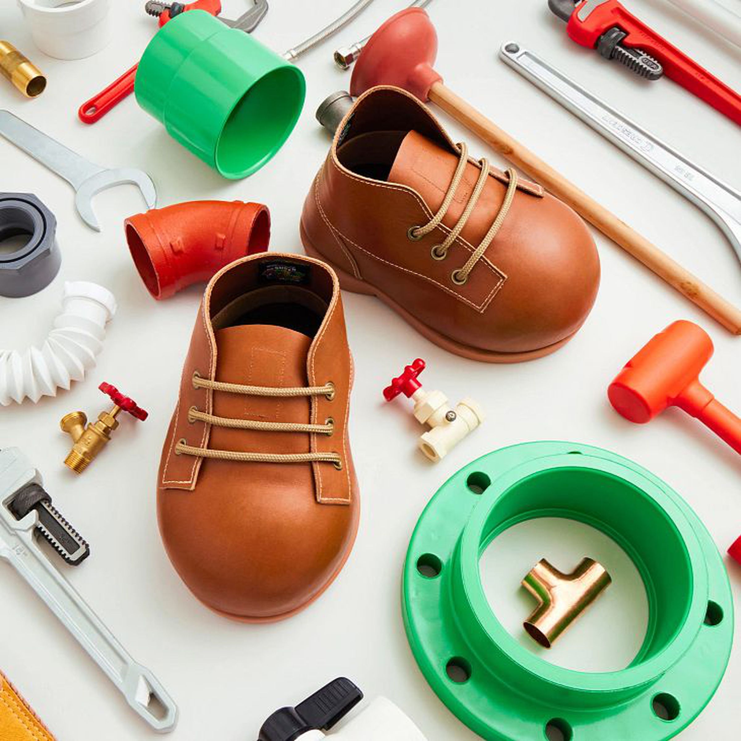 Red Wing Shoes’ Mario boots surrounded by tools and pipes.