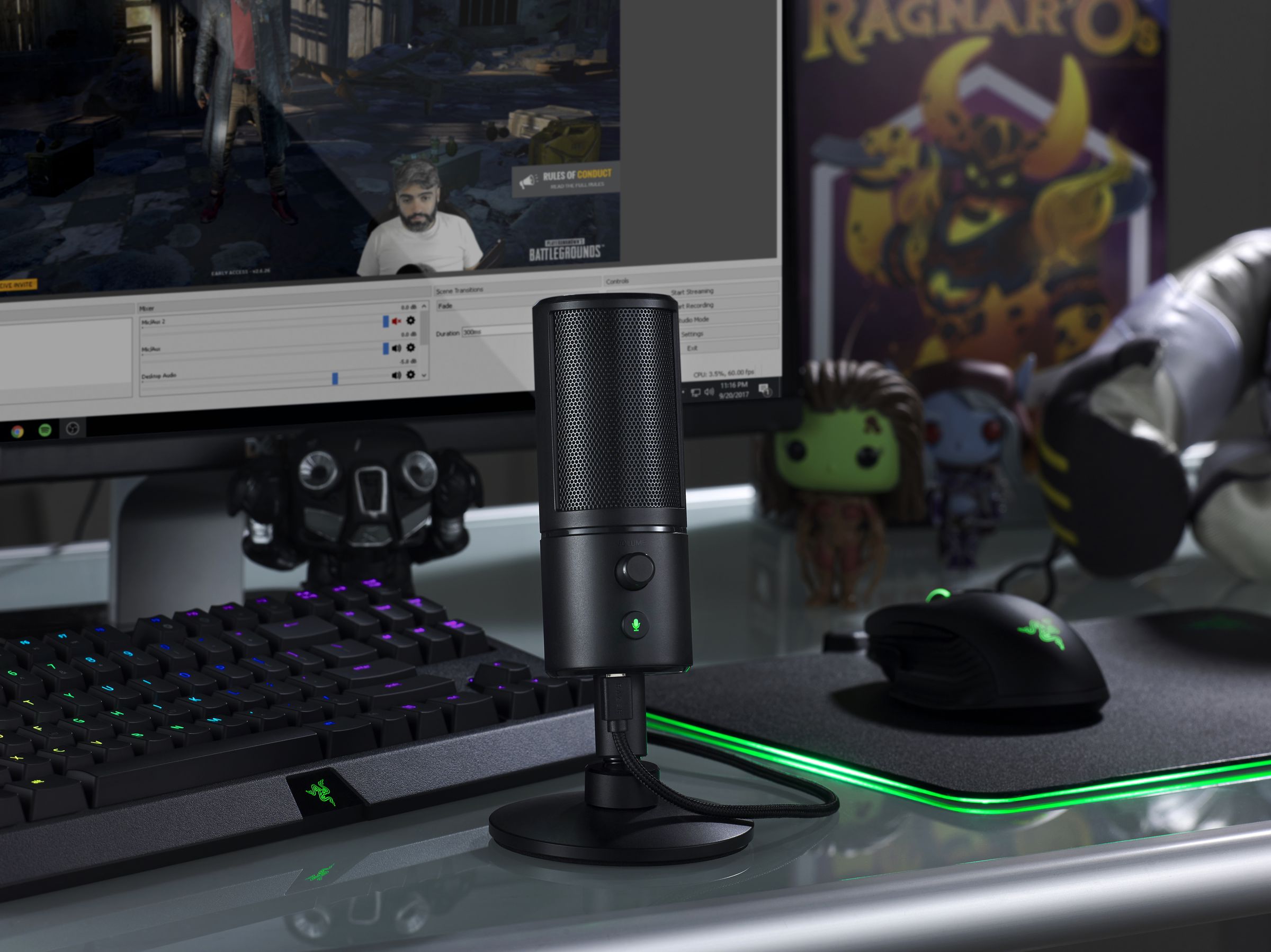 The Razer Seiren X microphone, beside a Razer keyboard and mouse.