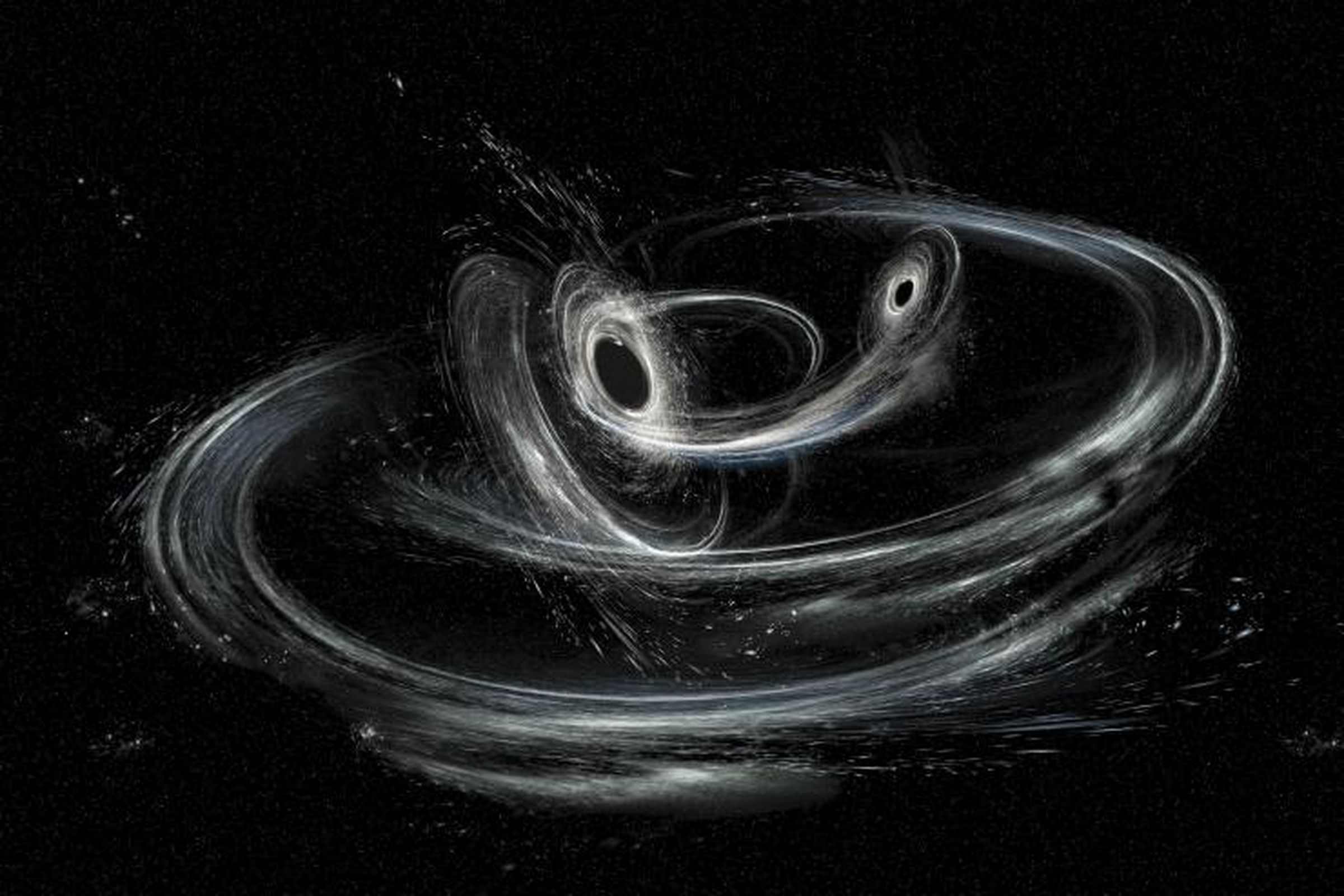 An artist’s illustration of two black holes merging.