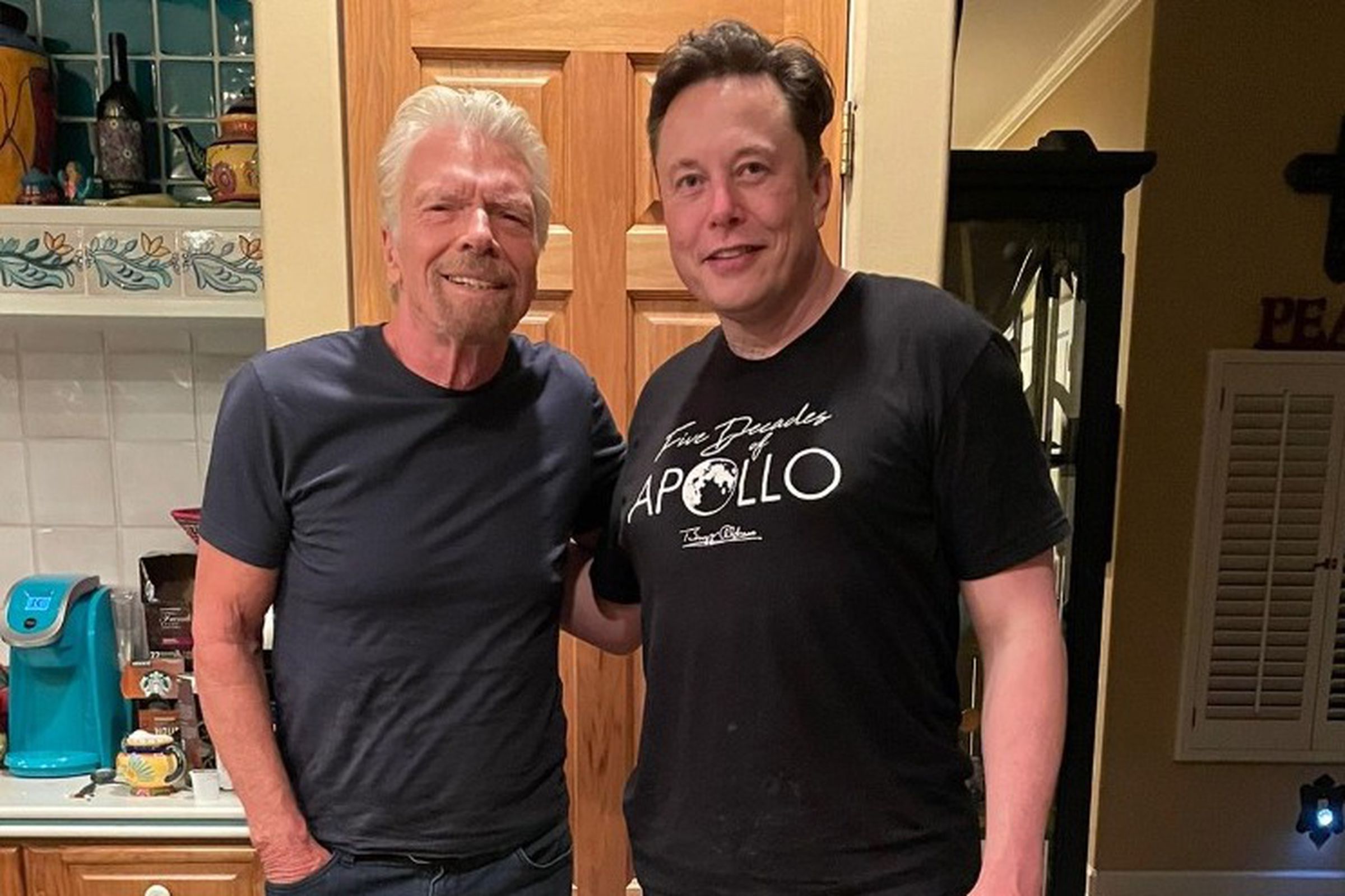 Richard Branson and a barefoot Elon Musk hang out on the morning of Branson’s launch to space.