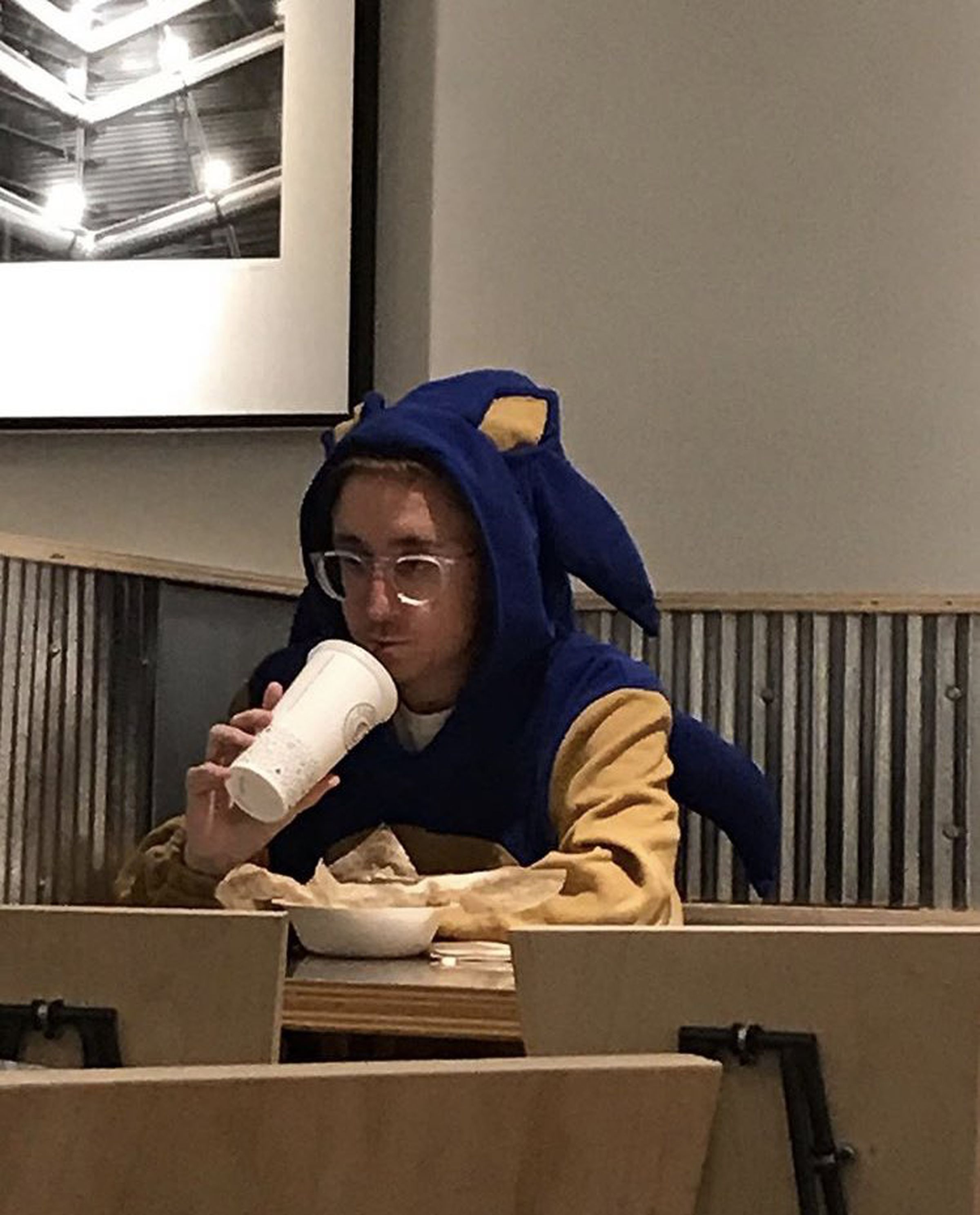 Cartoonist Alec Robbins, eating Chipotle while dressed as Sonic the Hedgehog.