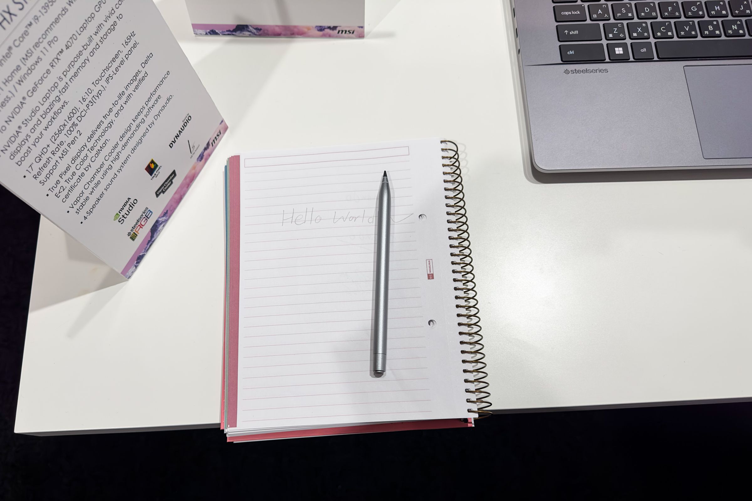 The MSI Pen 2 on top of a notebook.