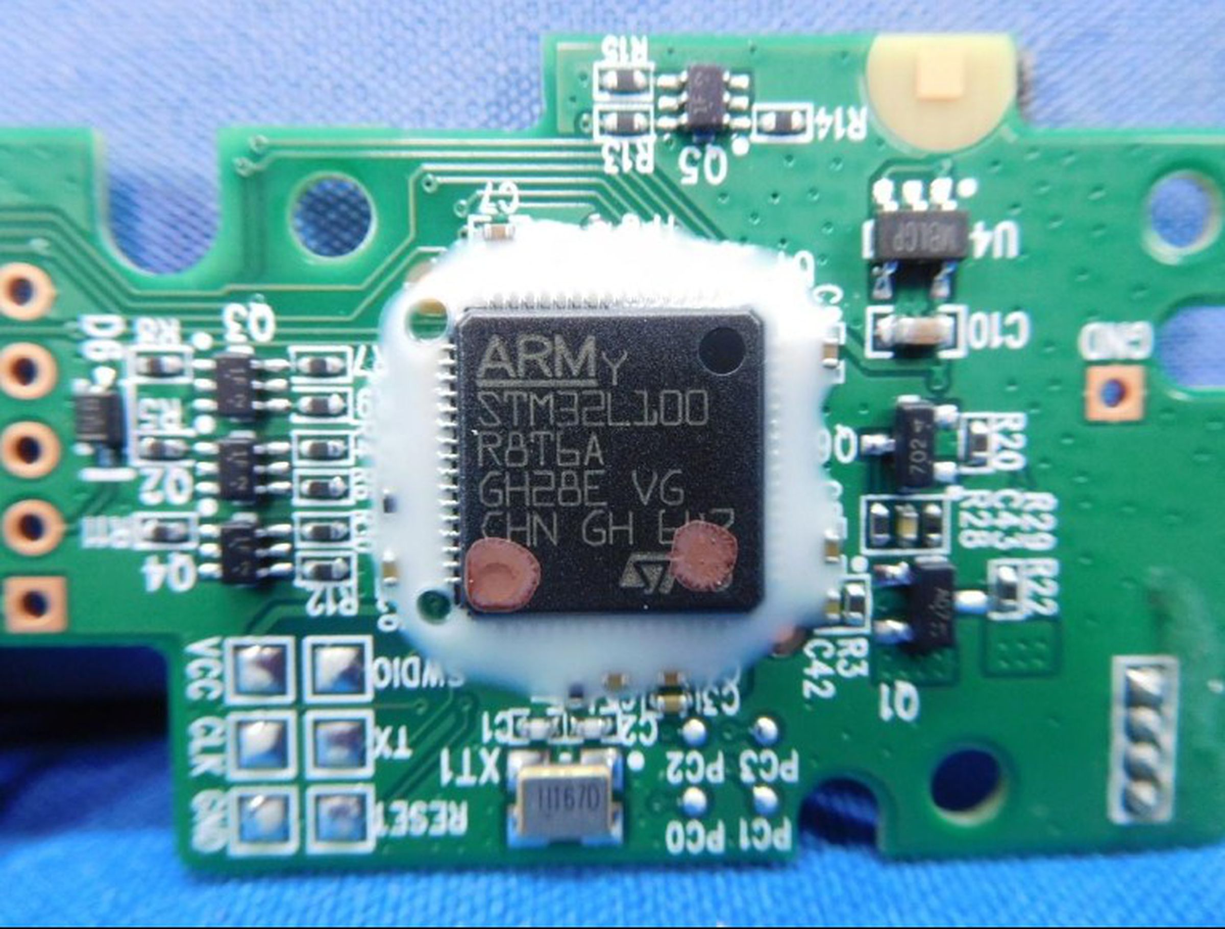 The Arm chip inside the Logitech Powerplay’s receiver module.