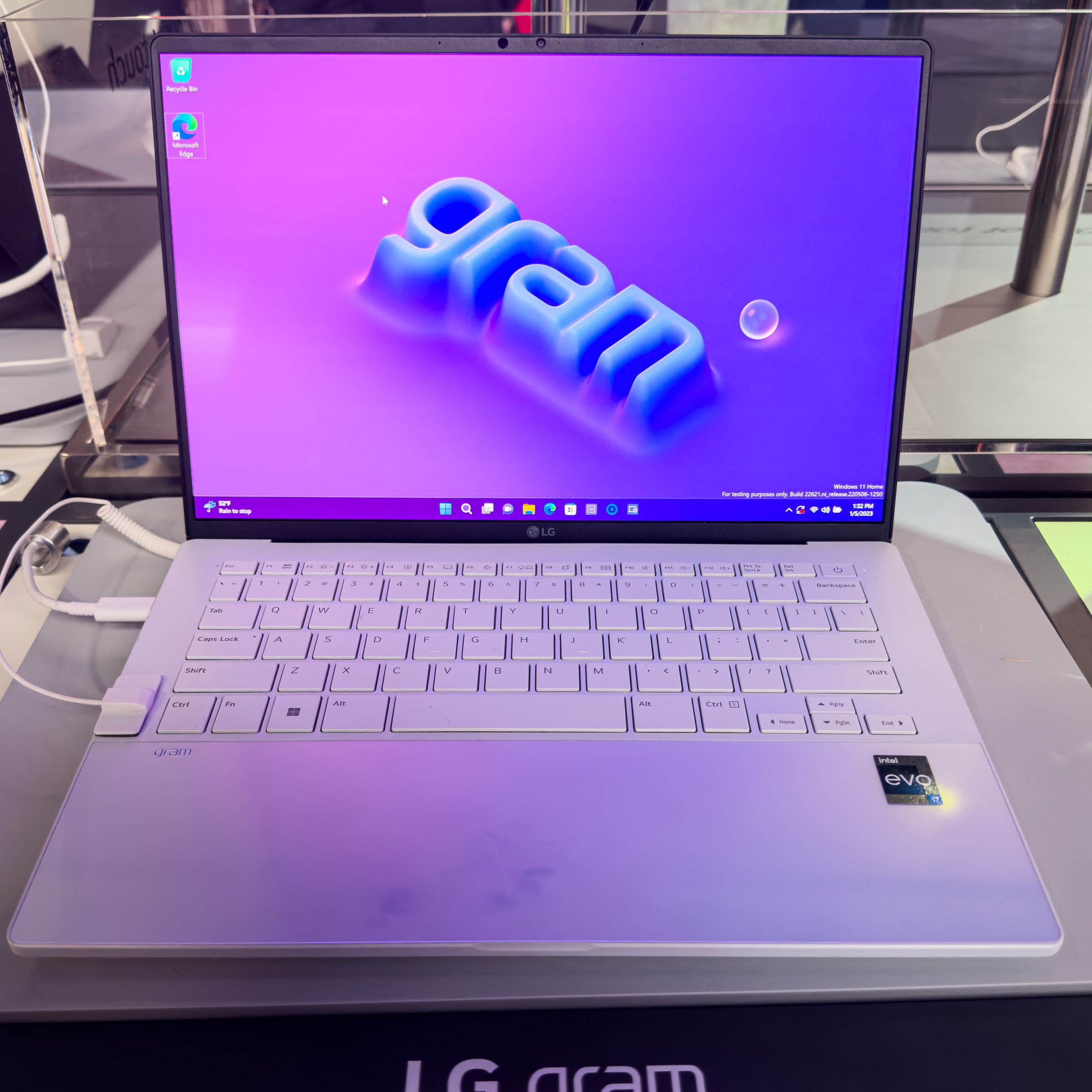 The LG Gram Style displaying the blue Gram logo on a purple background.