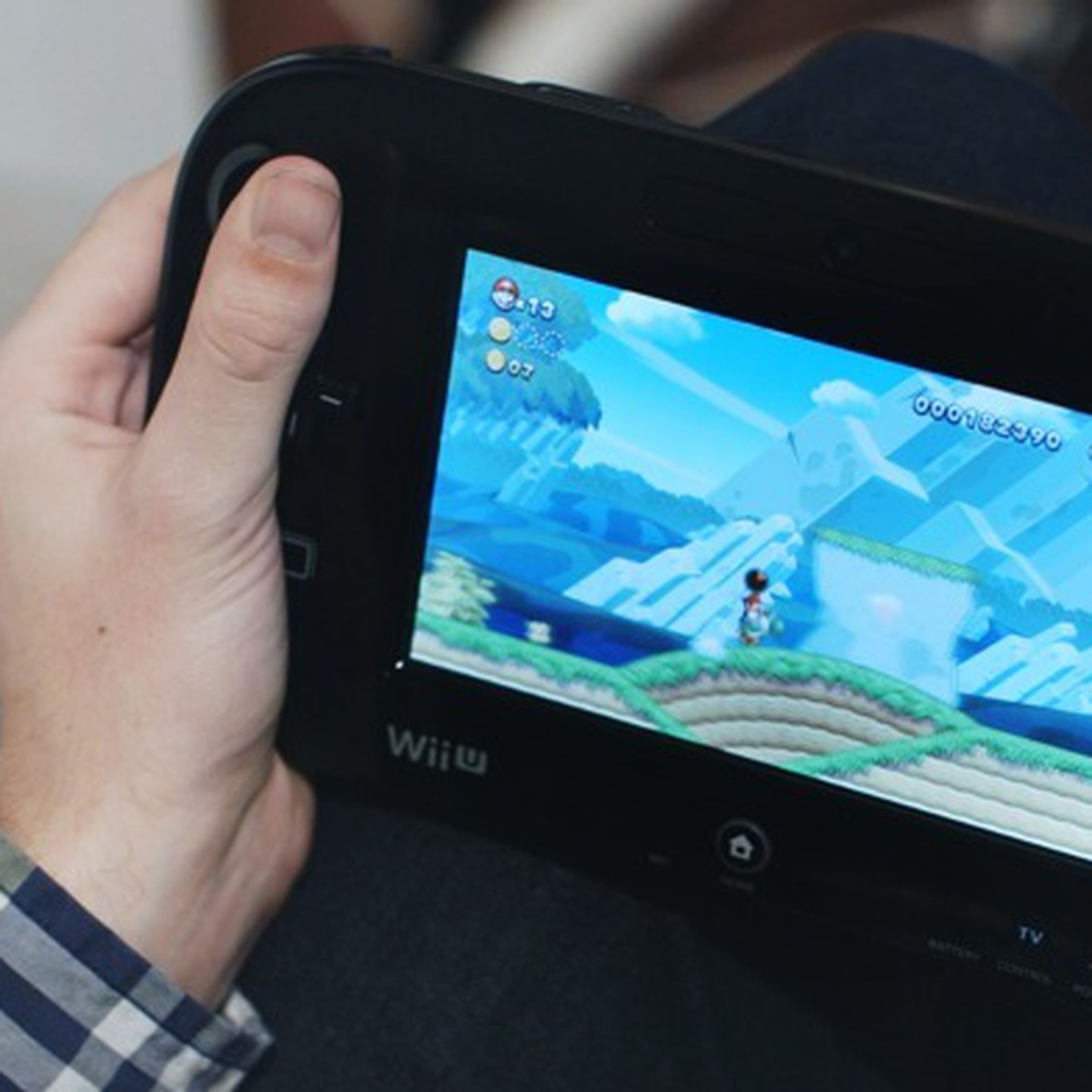 A photo showing someone playing the Wii U