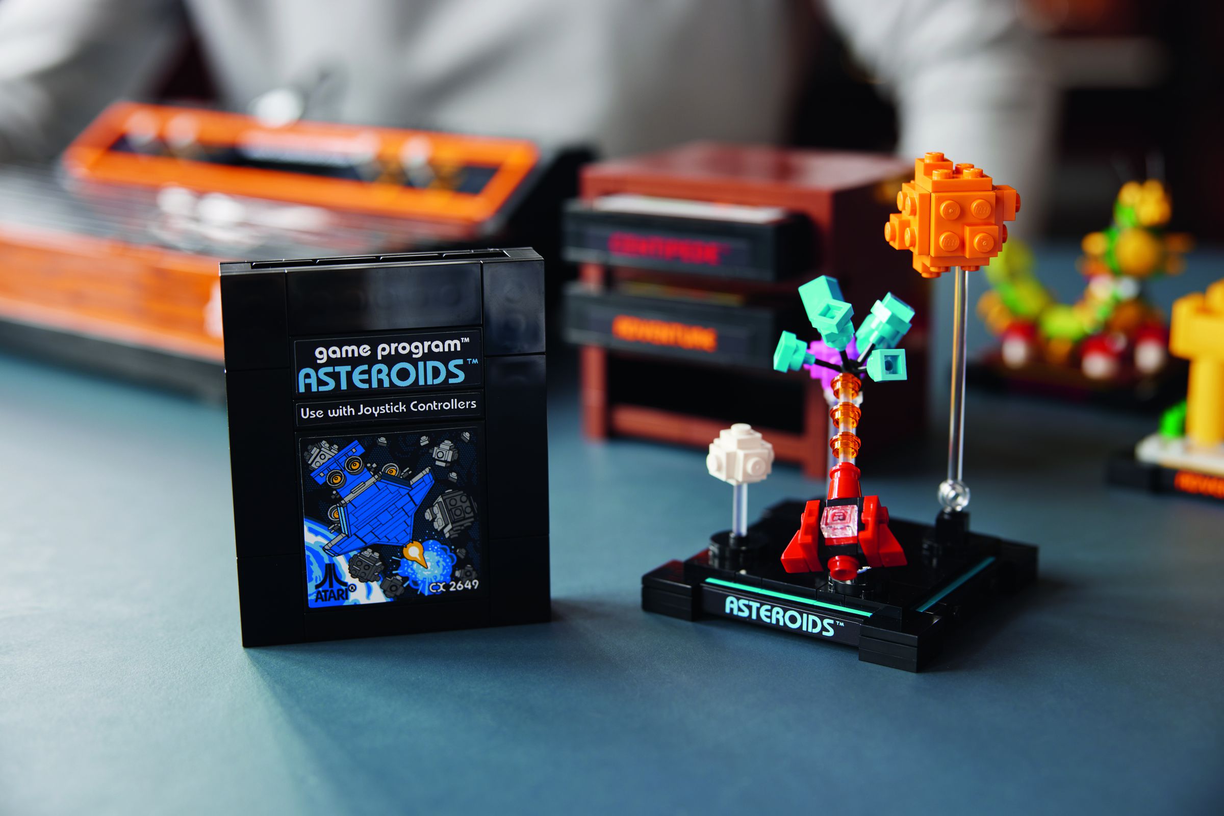 Asteroids is one of three game cartridges included with the set.