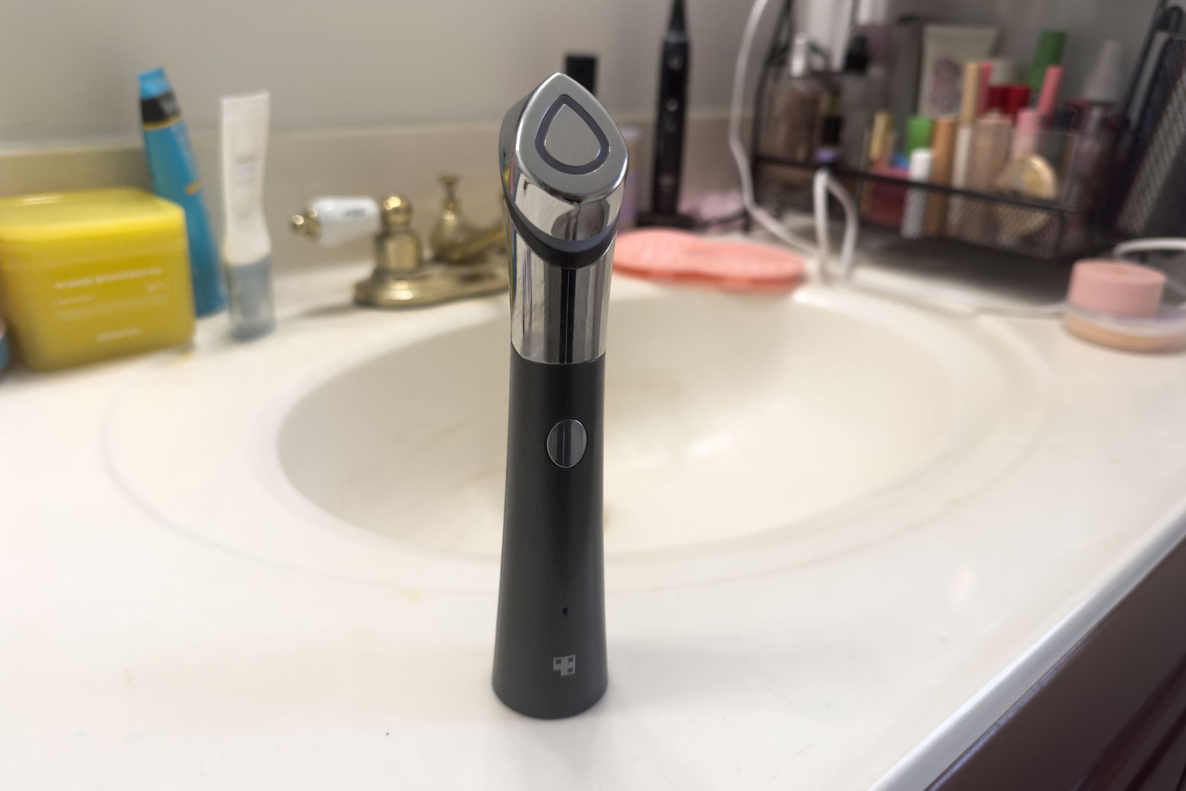 Medicube Age-R Booster-H standing upright in a bathroom