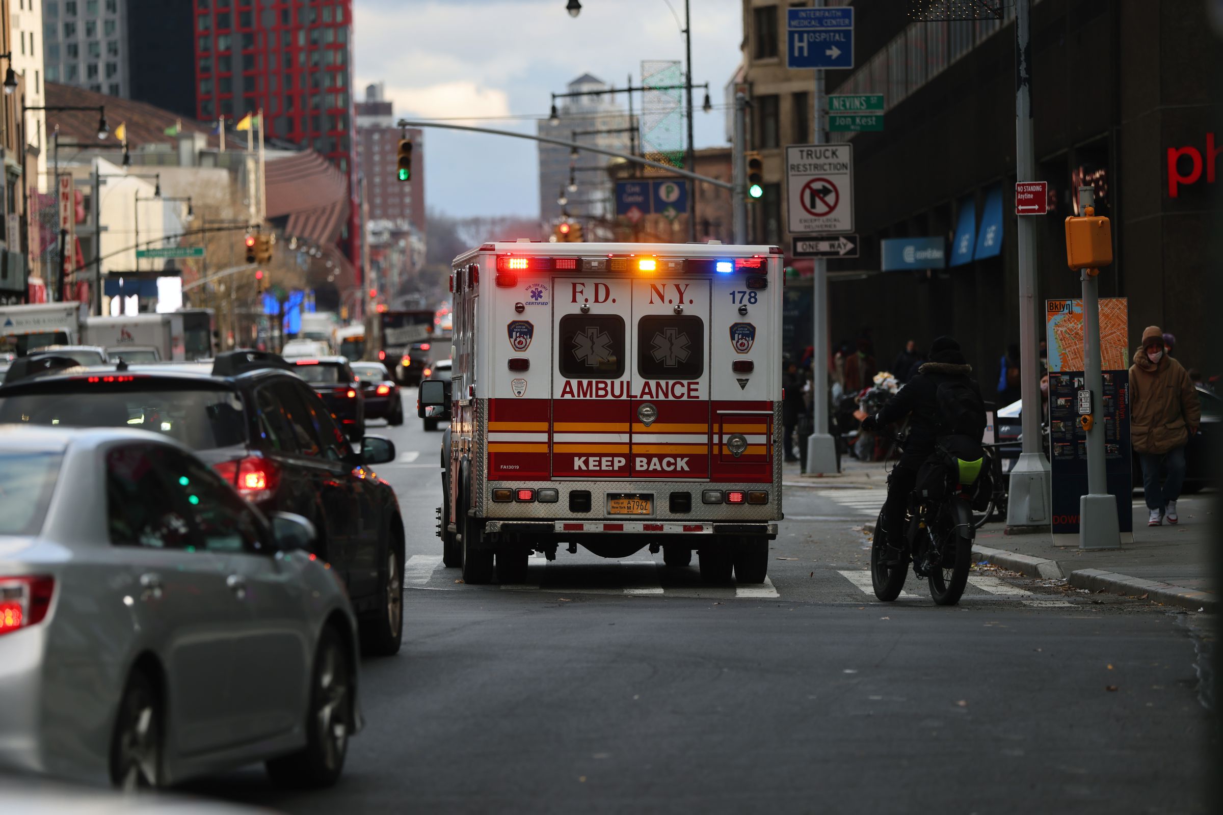 An ambulance drives down a road in Brooklyn on December 01, 2020 in New York City.&nbsp;