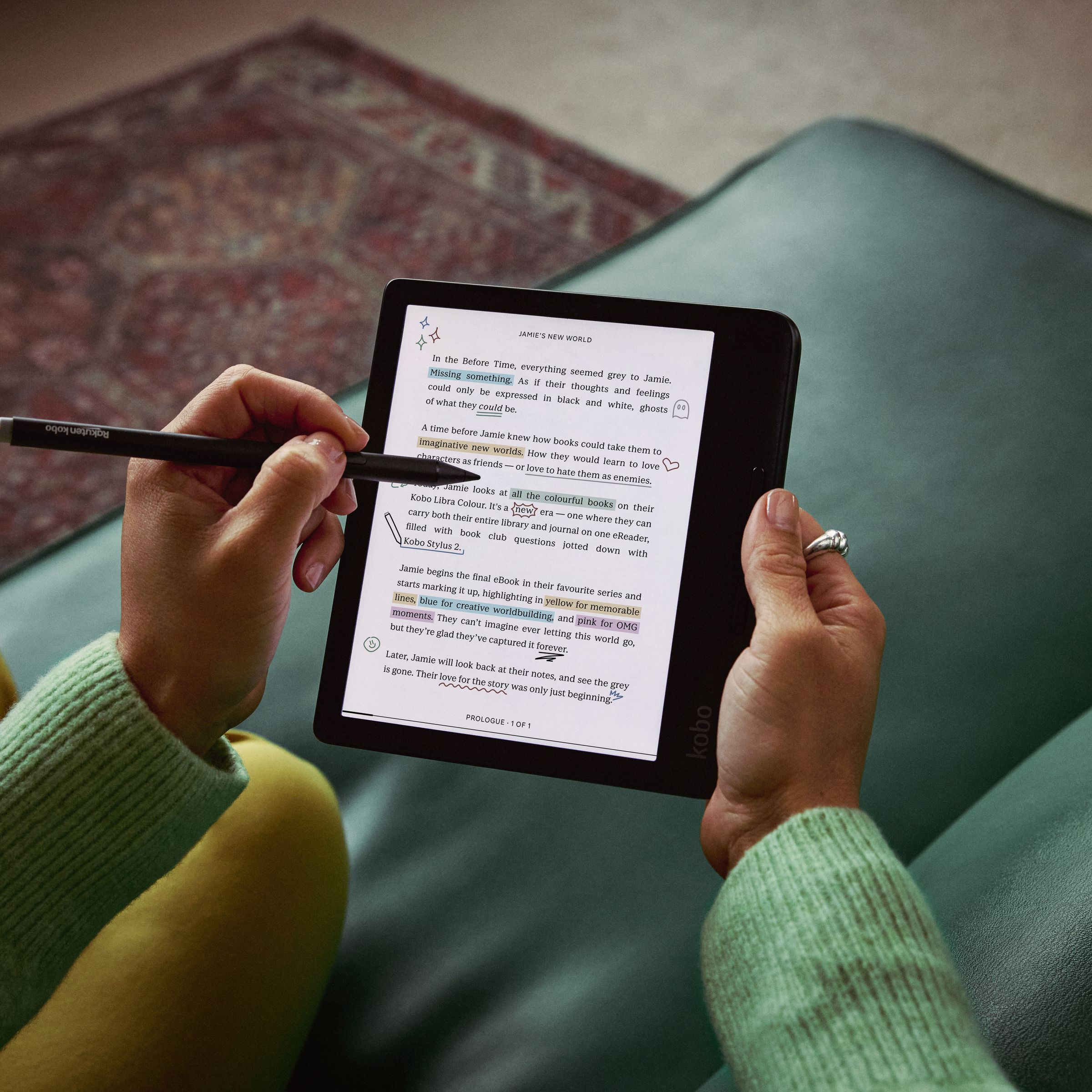 A hand using a stylus to take notes on the Kobo Libra Colour e-reader.