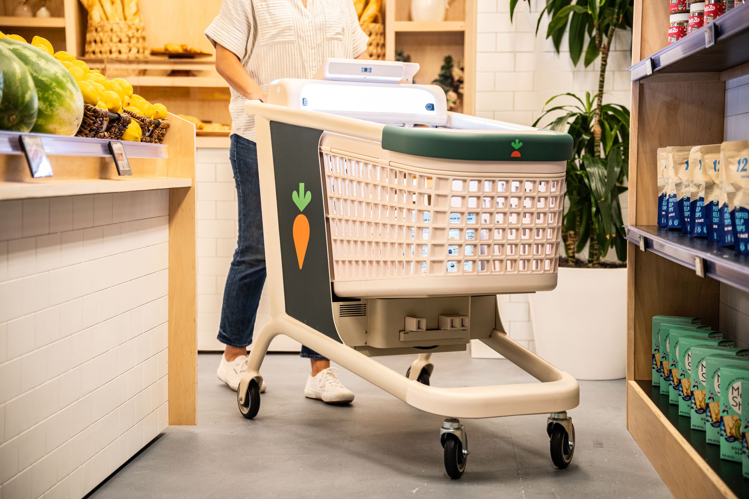 Multiple sensors and cameras detect products as you slowly lower them into the cart.
