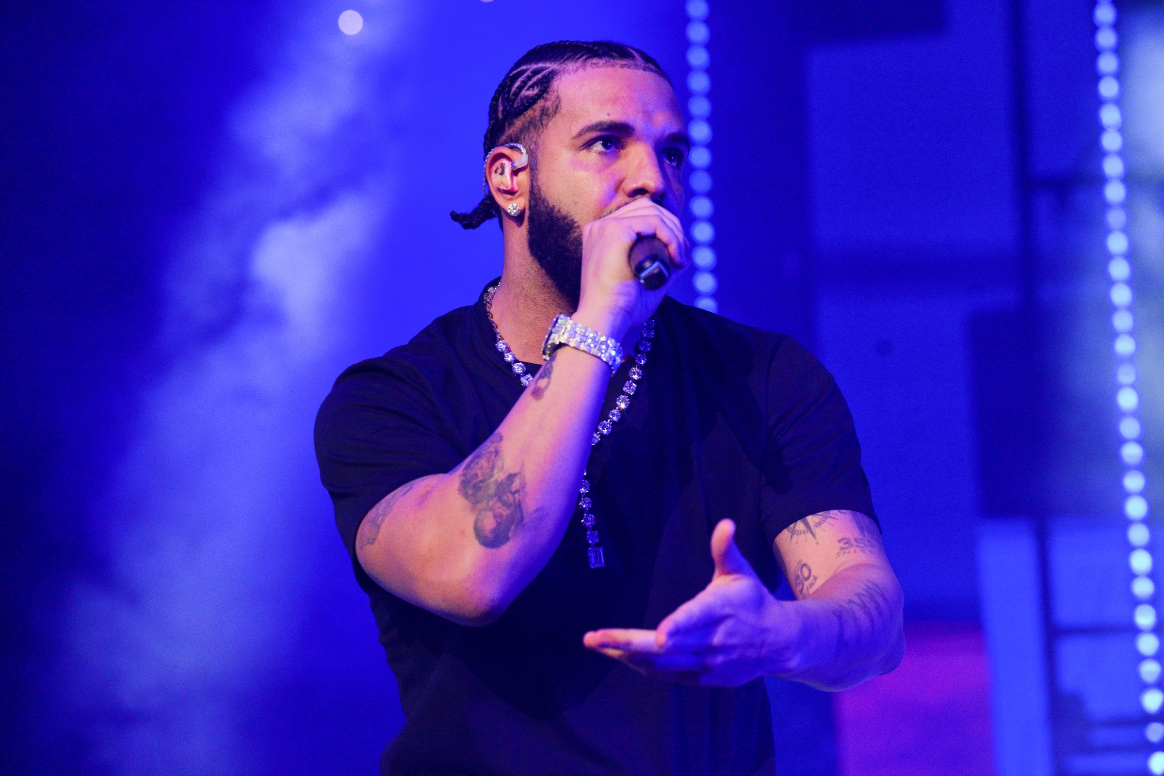 An image showing Drake performing onstage