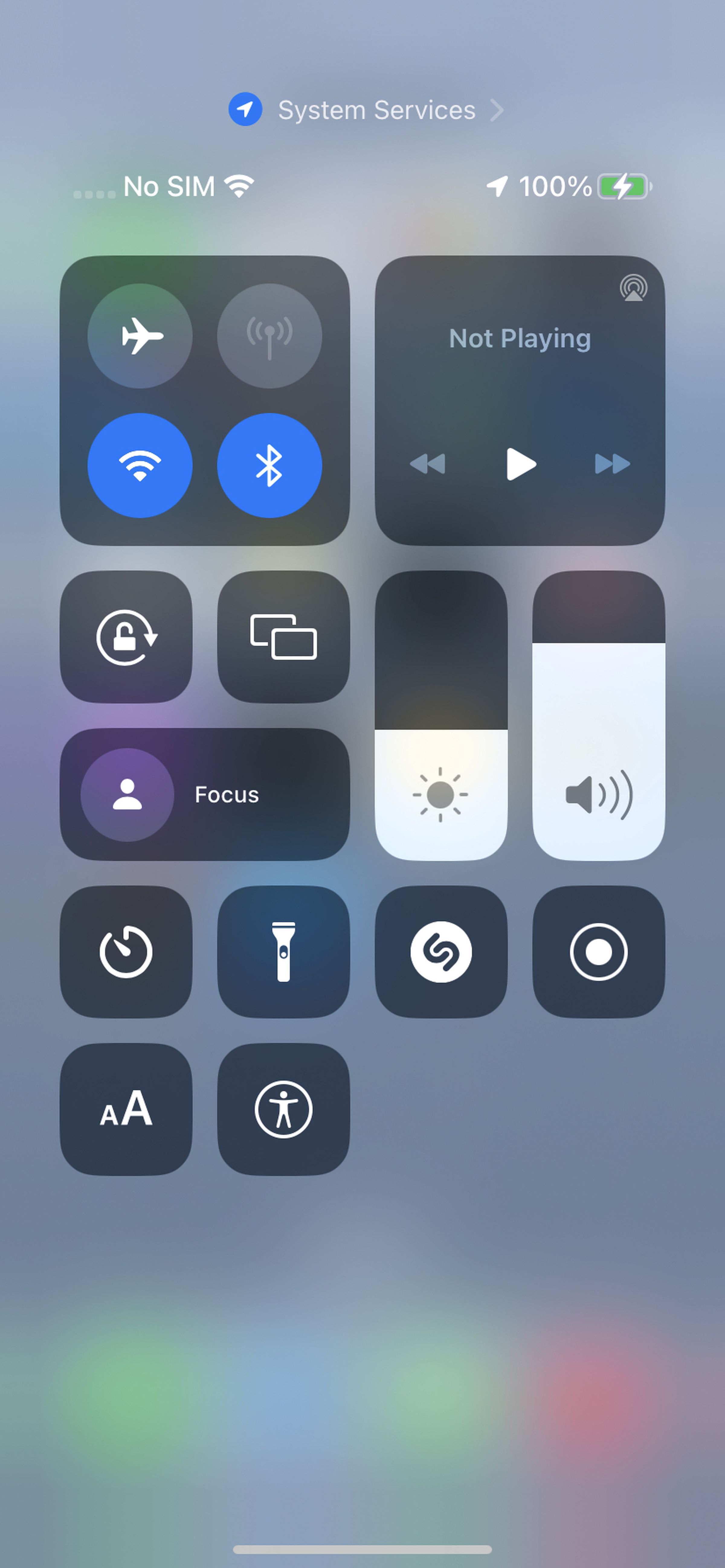The iOS Control Center buttons with a variety of buttons, including an Accessibility Shortcut on the bottom row.