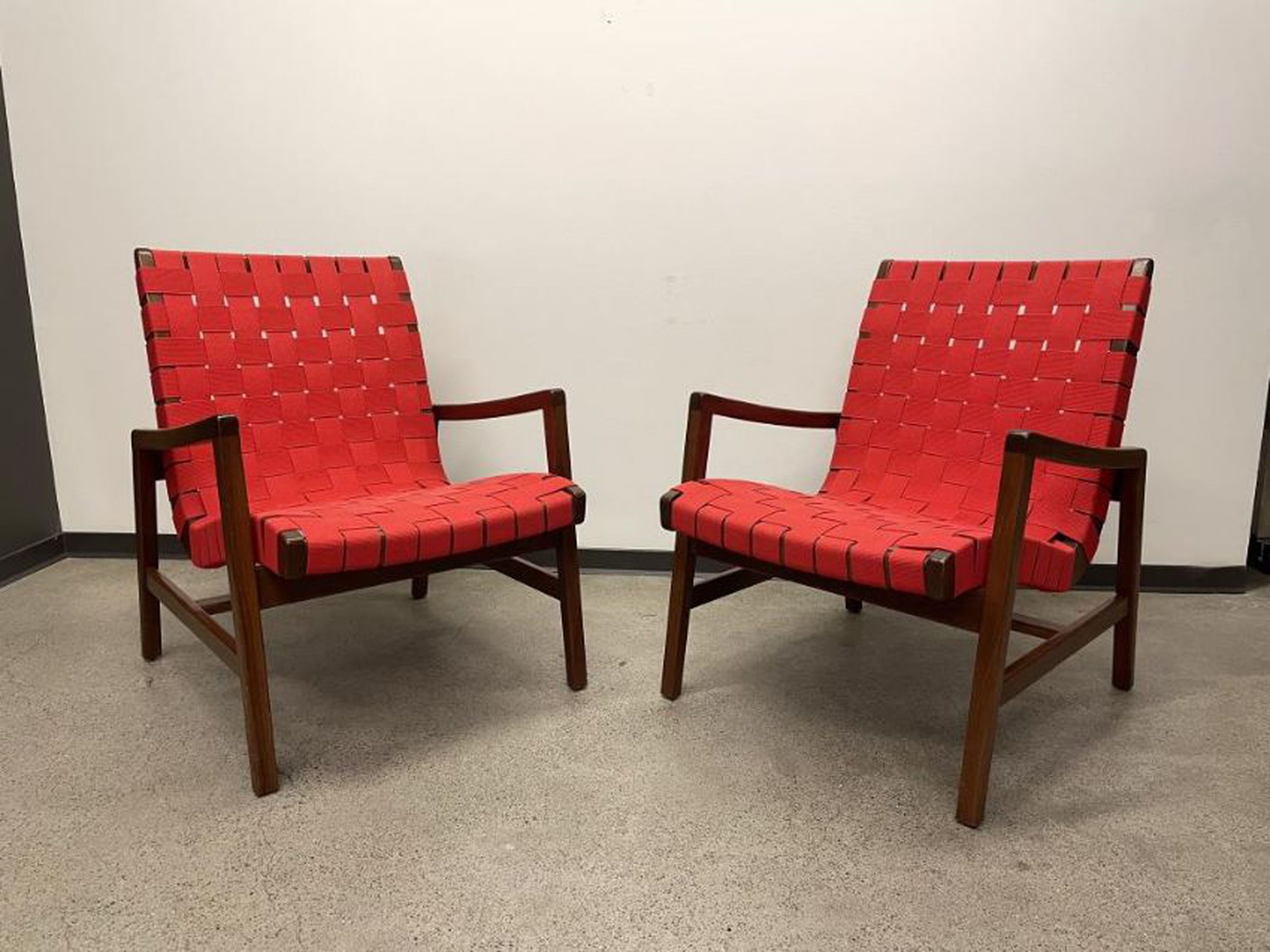 Two Knoll Studio Risom lounge chair in red
