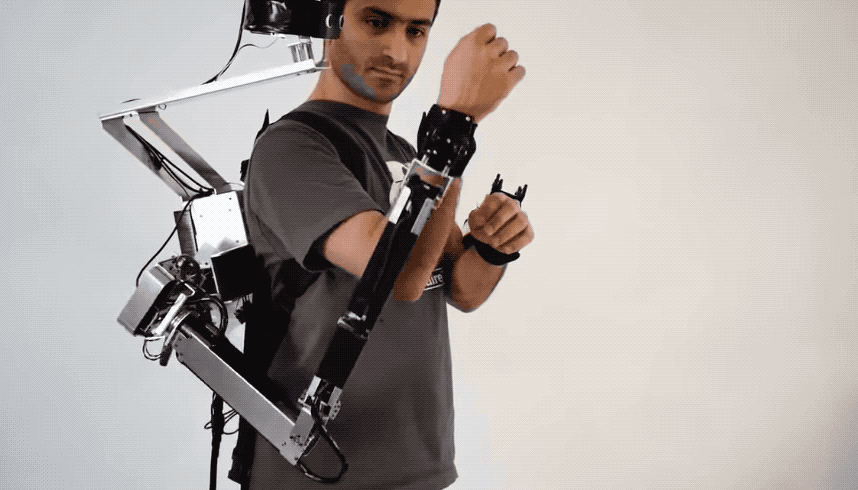 In “enforced posture” mode, the robotic arms are used to control the wearer’s limbs. 