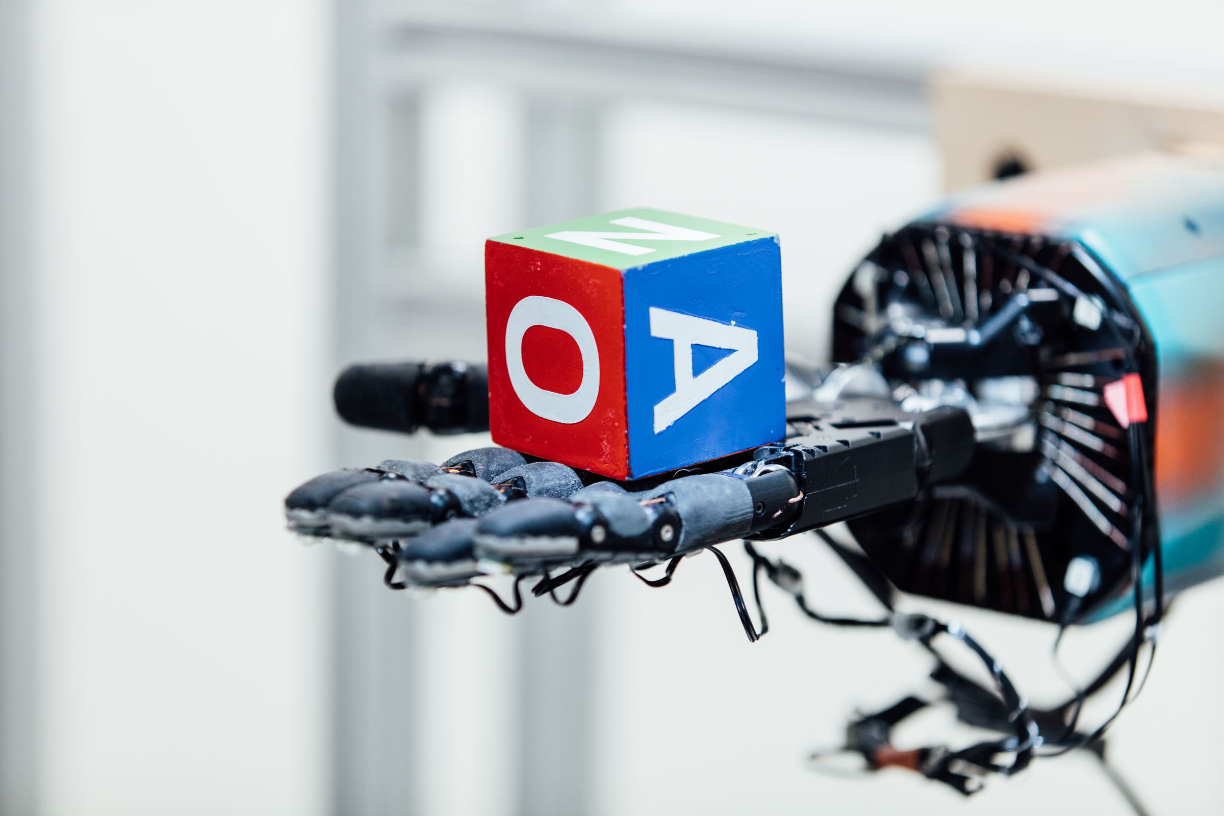 Some of OpenAI’s recent work has included improving robot dexterity. 