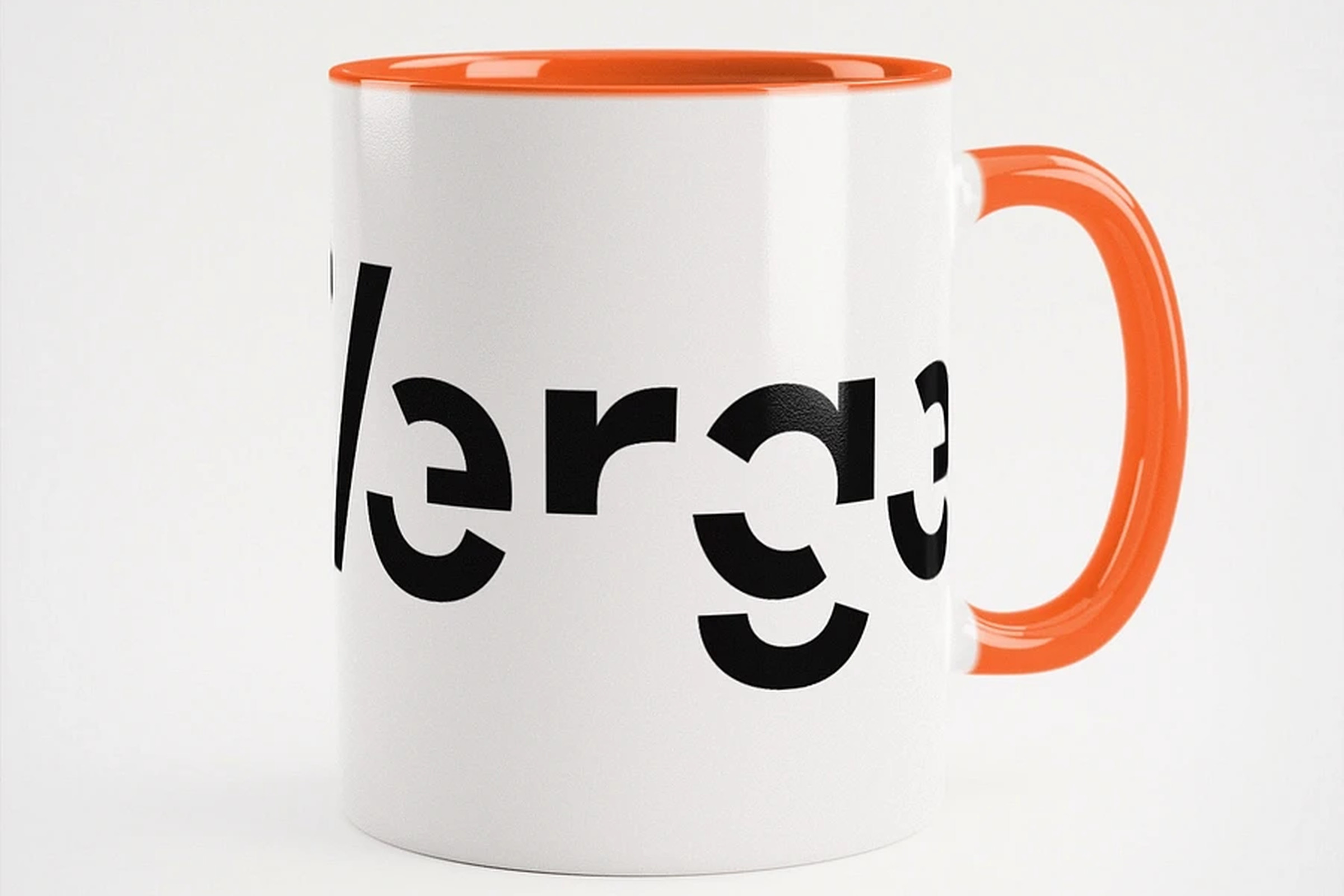 White mug with The Verge logo and orange on the inside