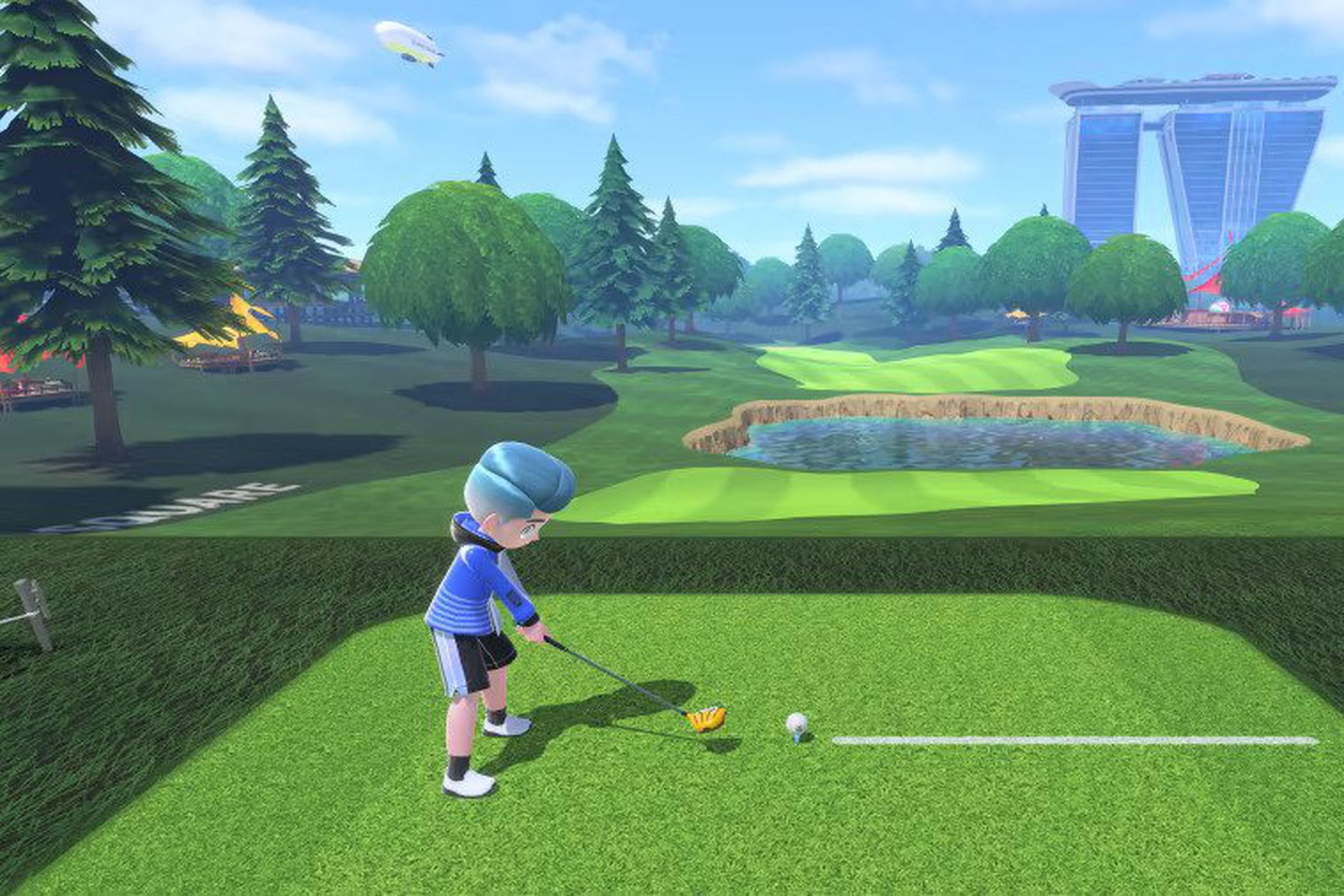 Screenshot from Nintendo Switch Sports featuring a blue-haired boy teeing up to swing on the green.