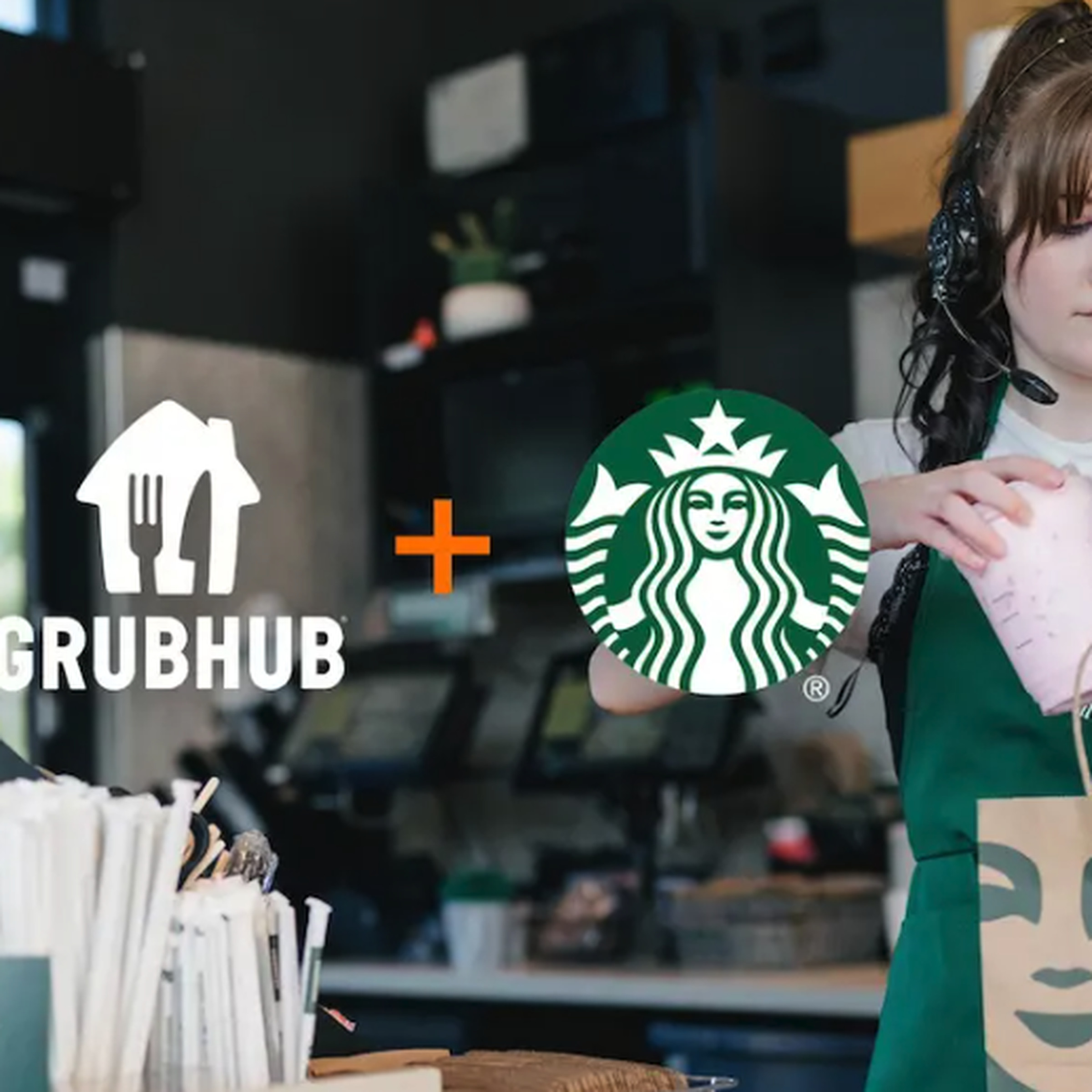 Starbucks barista to the right making a beverage with Grubhub and Starbucks logos in the middle. 