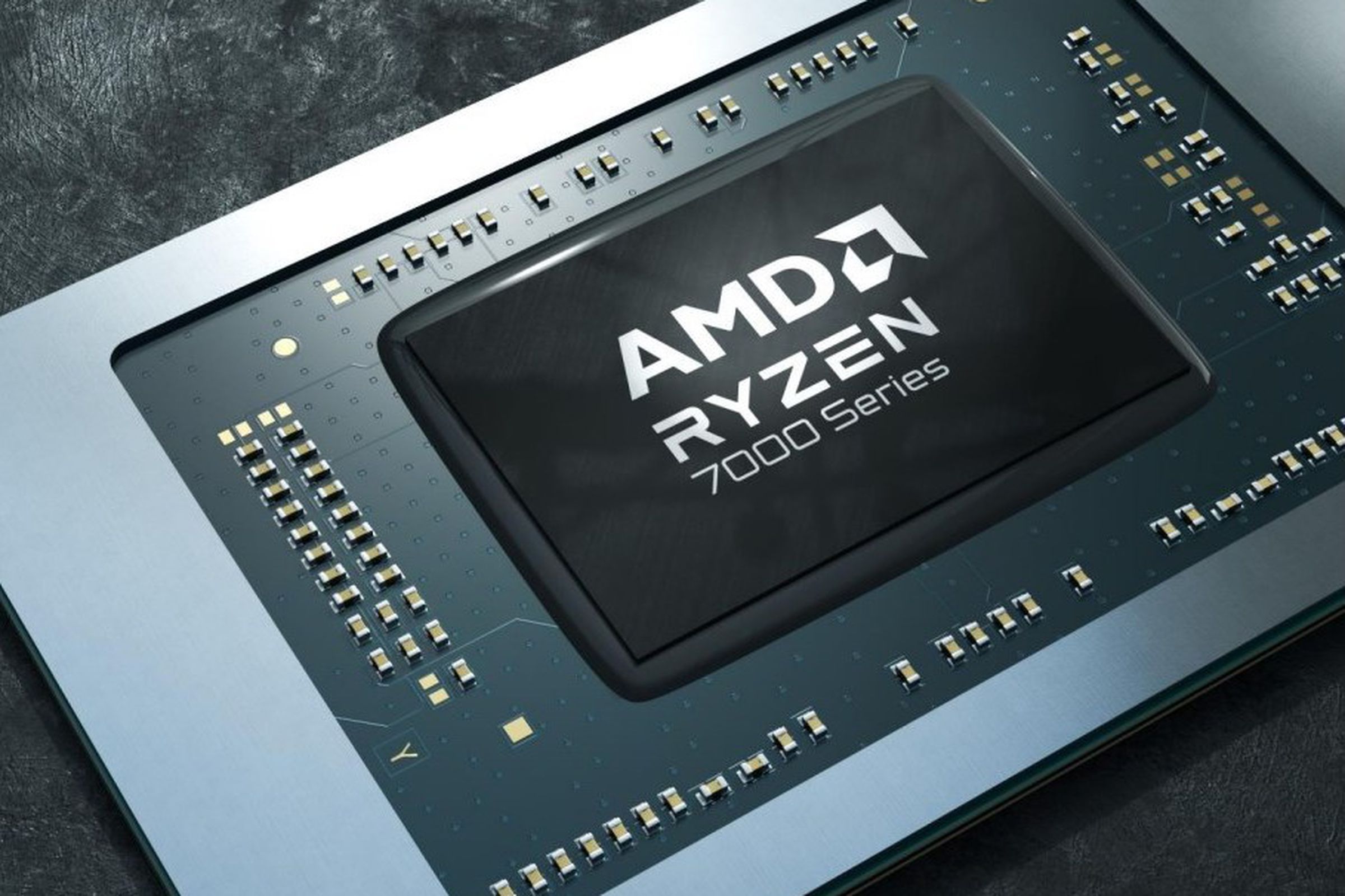 Chip reads AMD Ryzen 7000 Series in silver font on a shiny black chip with a green circuit background.