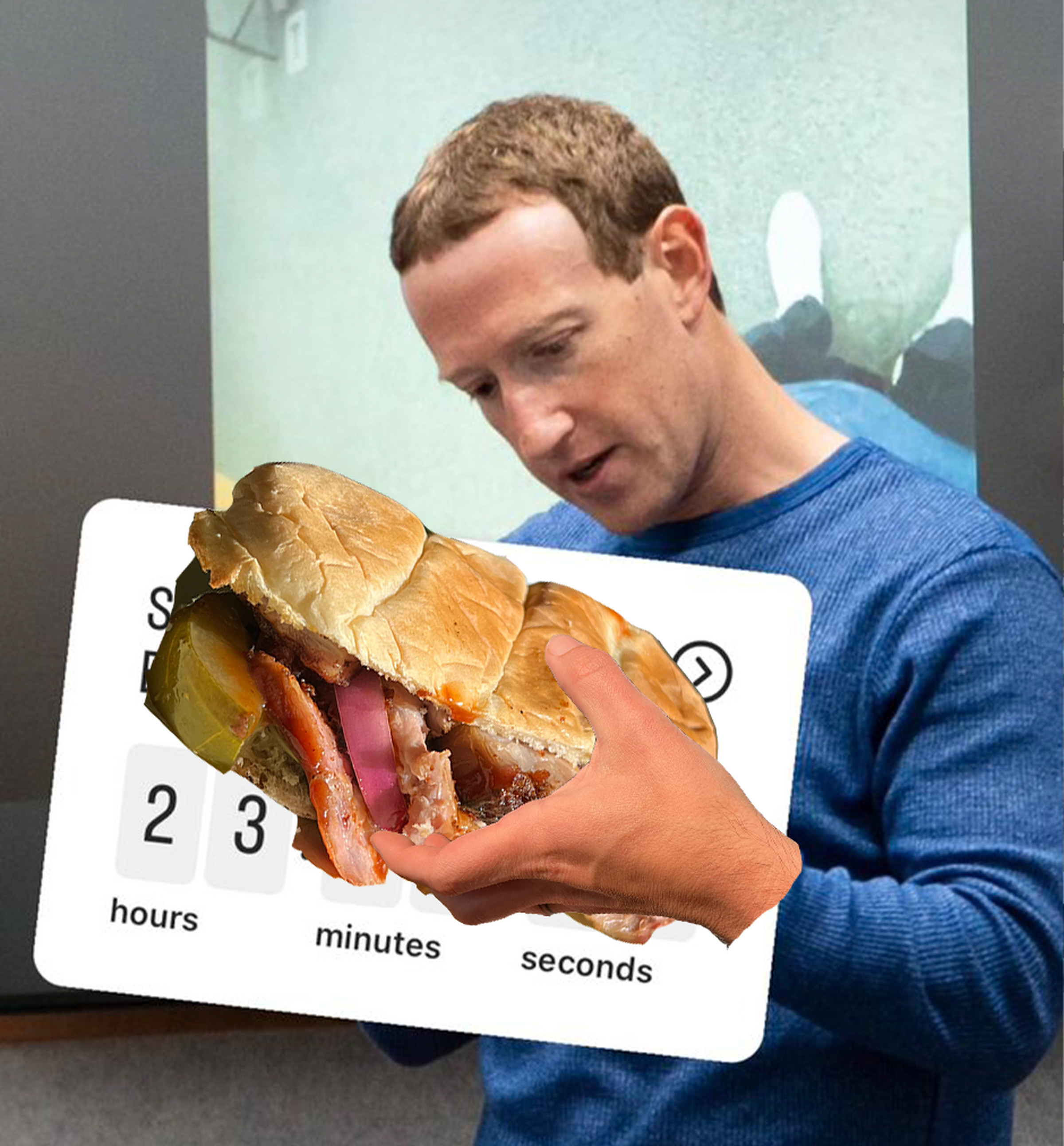 A bad photoshop of Mark Zuckerberg holding a sloppy sandwich