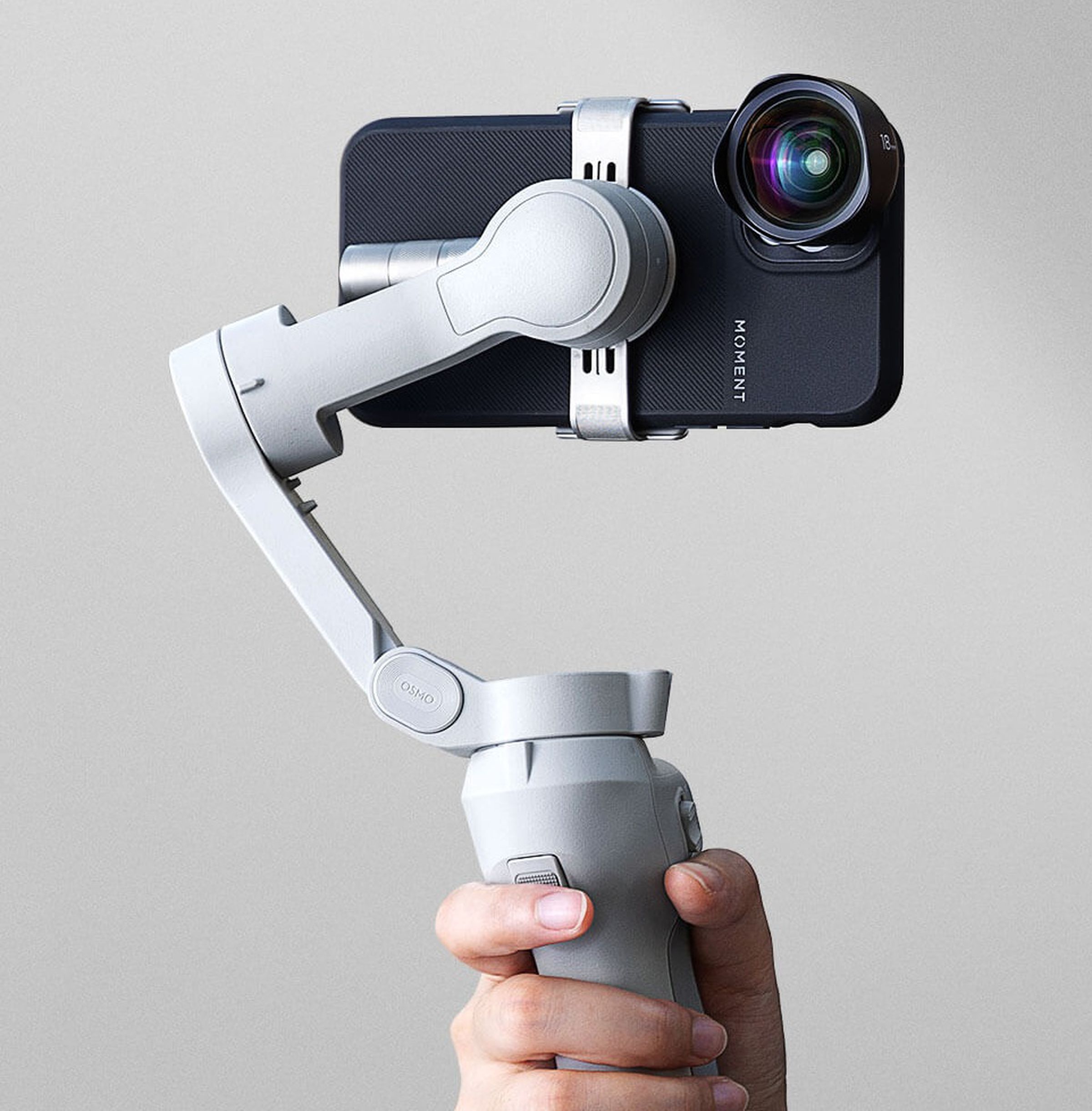 The DJI Osmo Mobile 4 and a Moment case and lens.