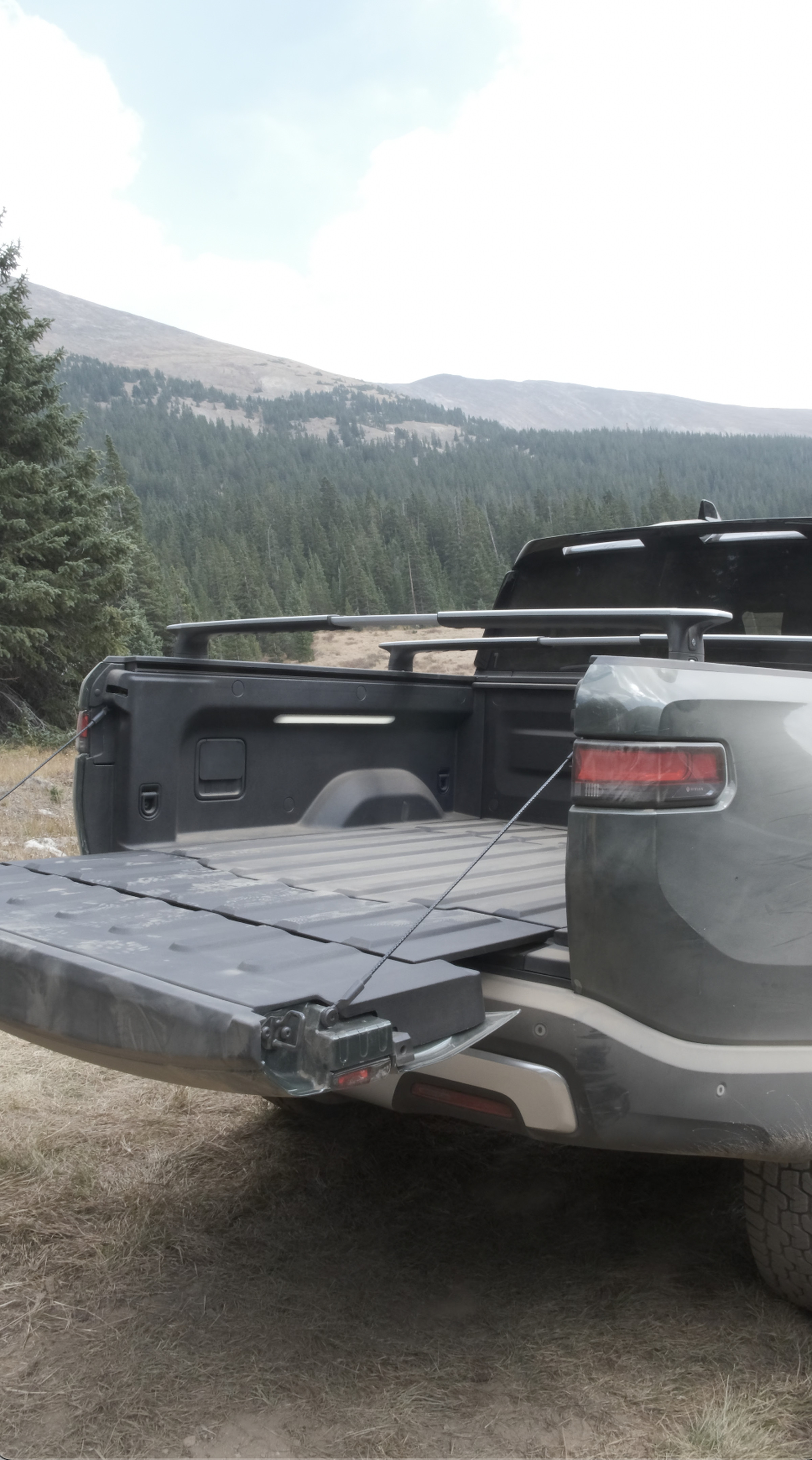 Rivian says the gooseneck hinge allows for the 4.5-foot long bed to be expanded to 83.6 inches.