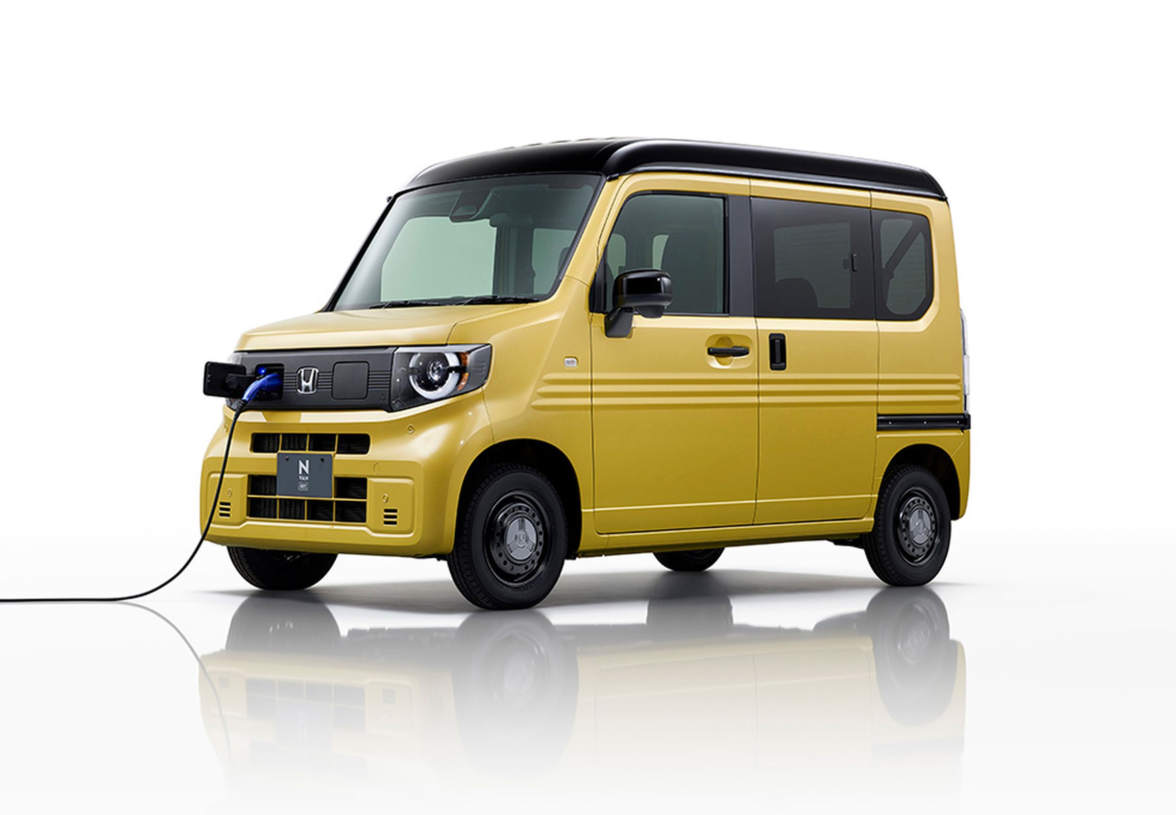 yellow boxy Honda van with ev plug