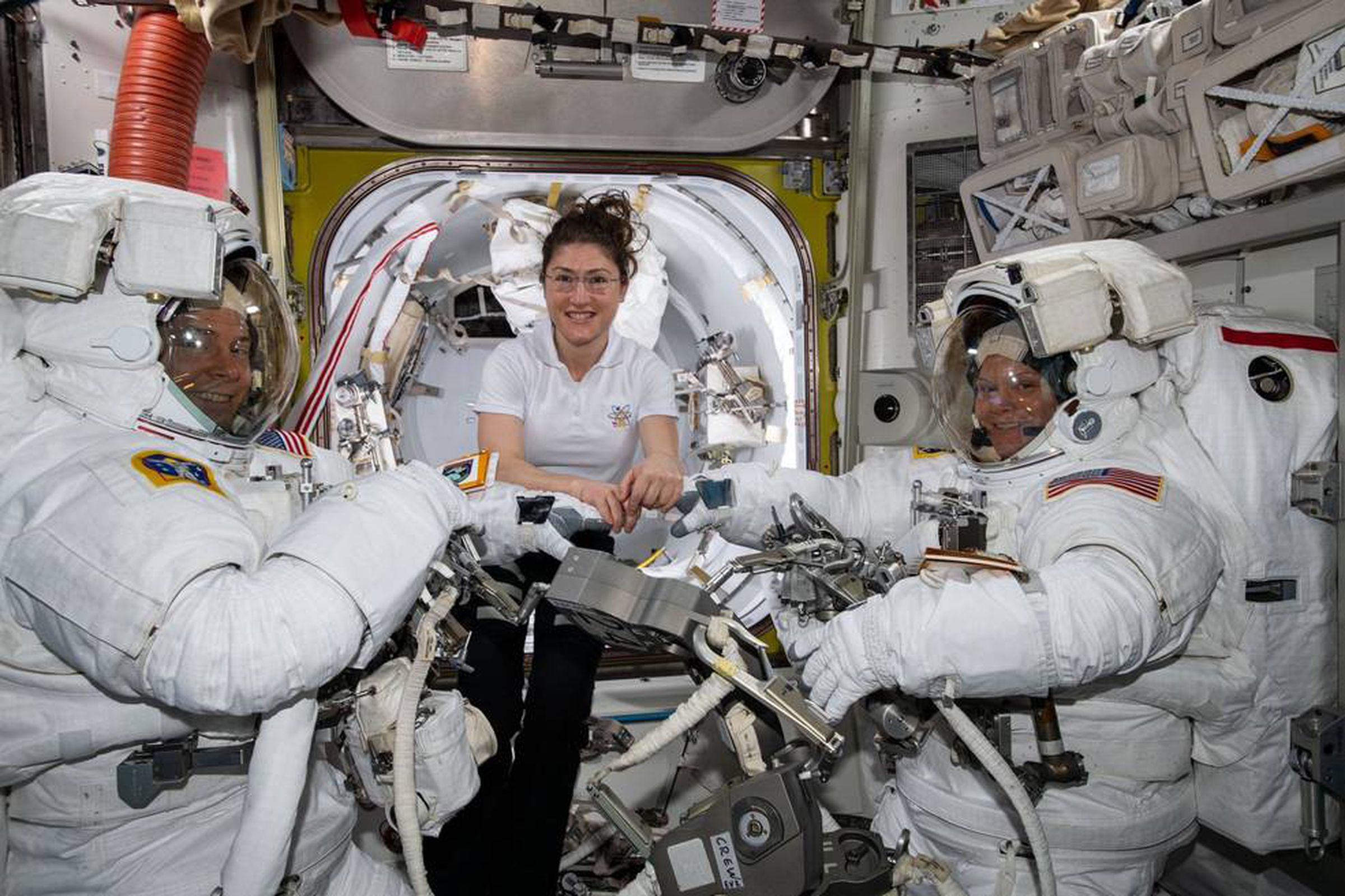 NASA astronauts Nick Hague (L), Christina Koch (C), and Anne McClain (R)