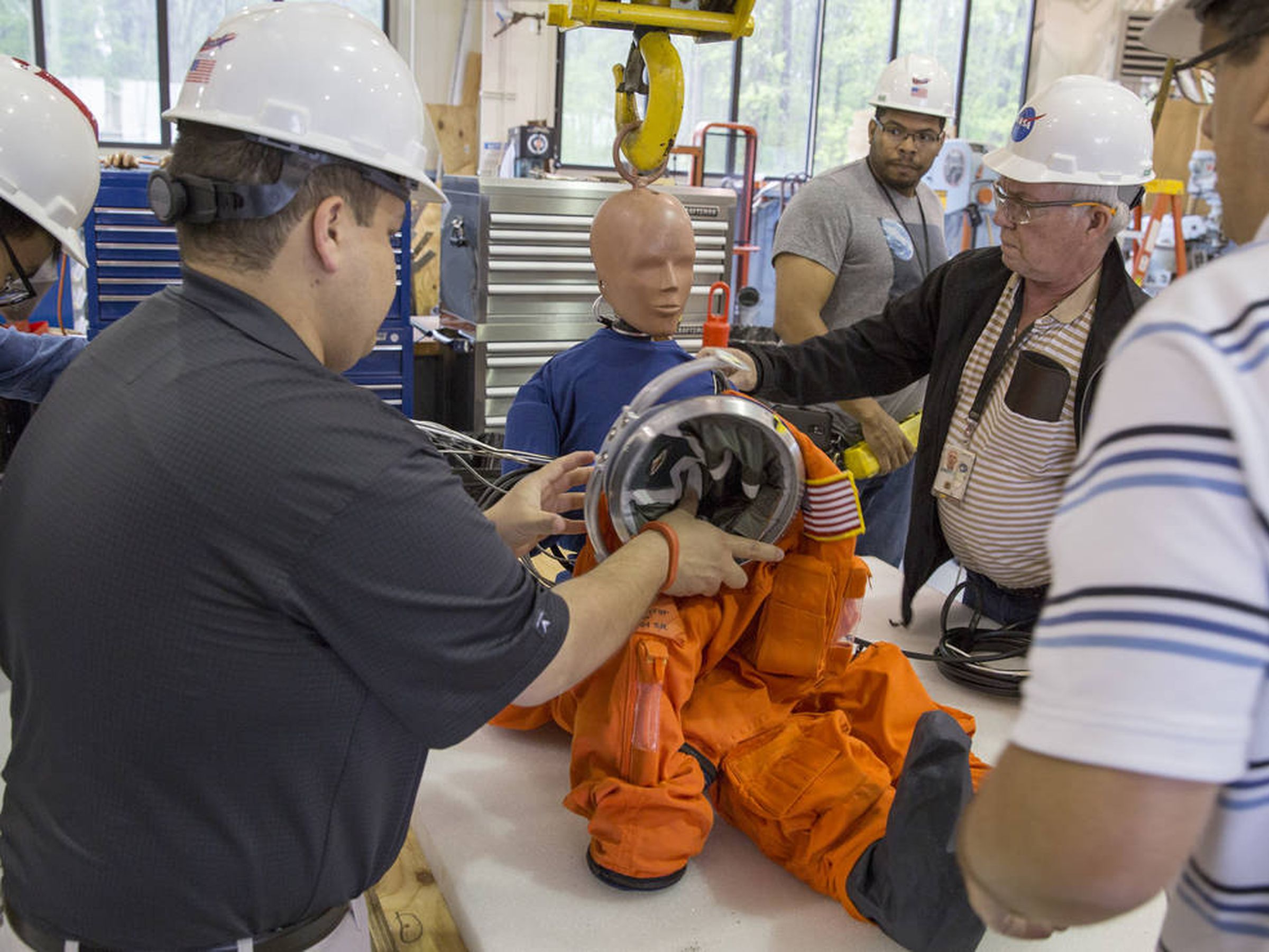 Dressing the dummy for an Orion drop test.