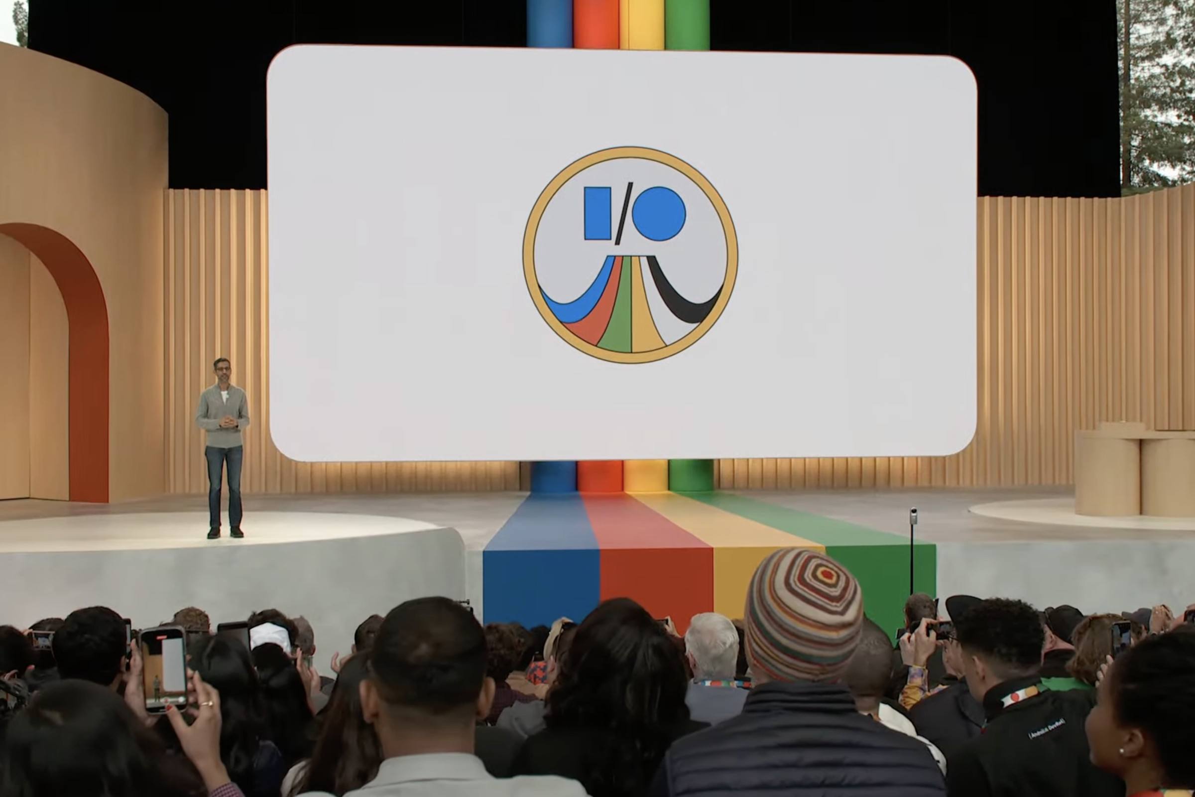 A screencap showing Sundar Pichai on stage at Google I/O