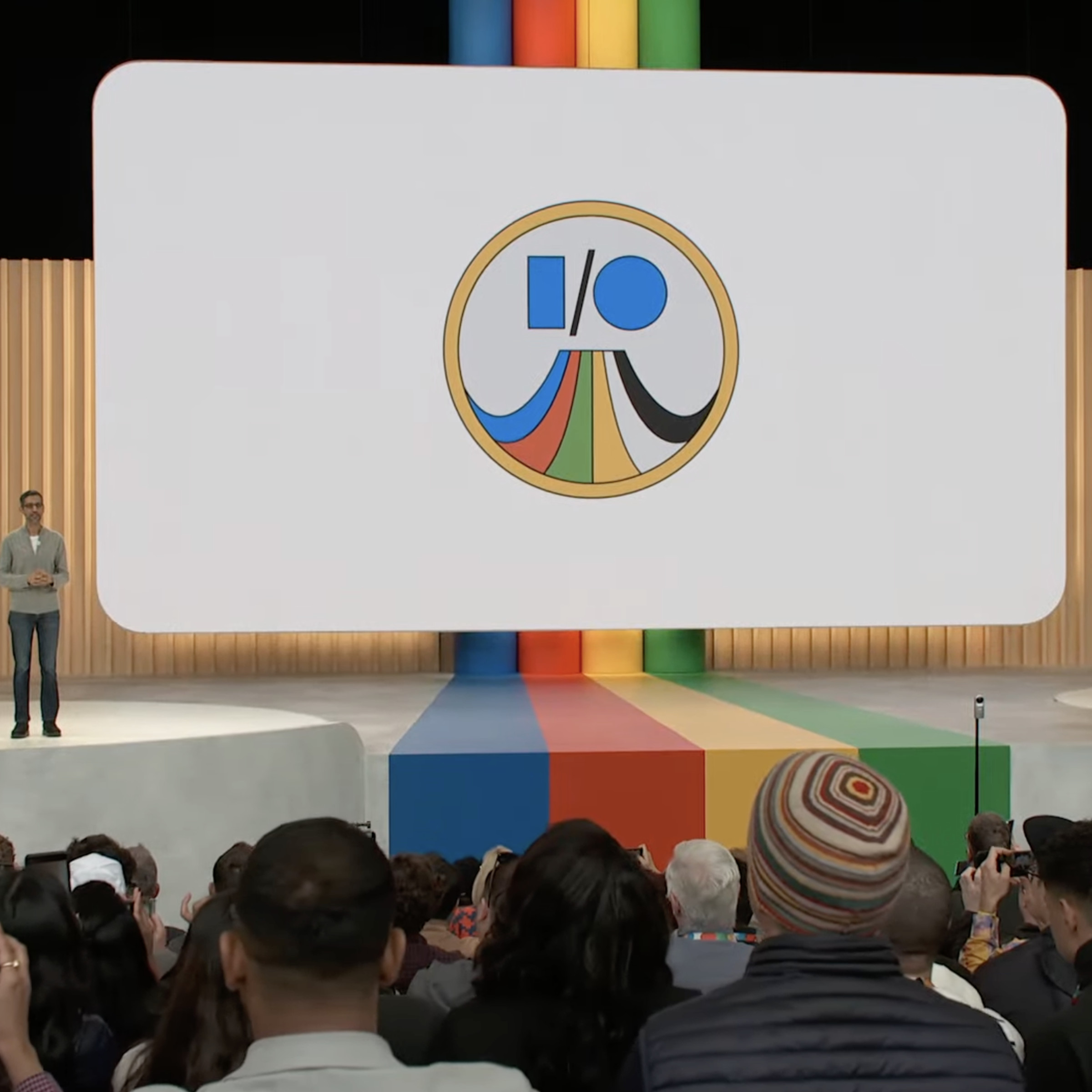 A screencap showing Sundar Pichai on stage at Google I/O