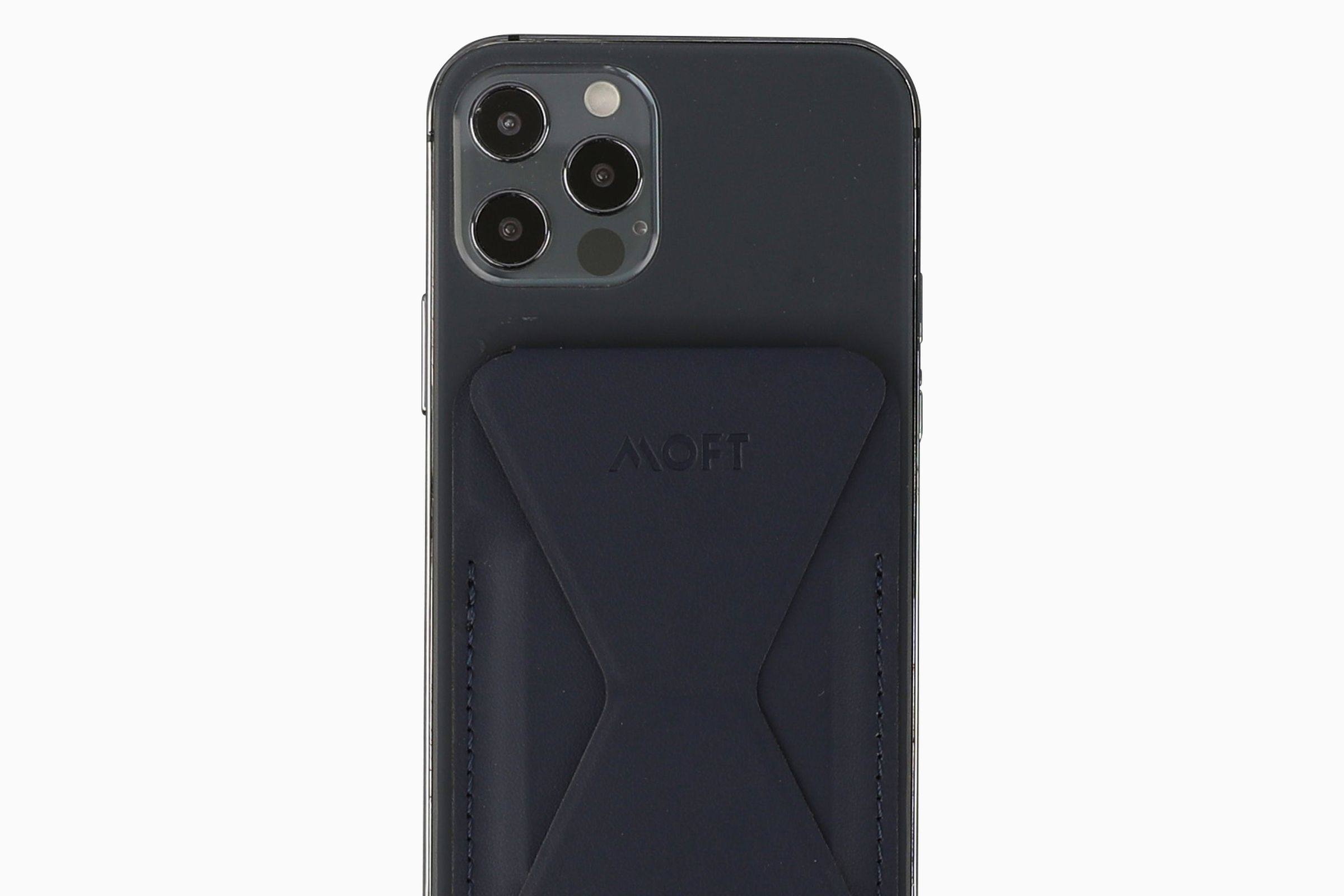 A photo of an iPhone 12 Pro with the MOFT wallet