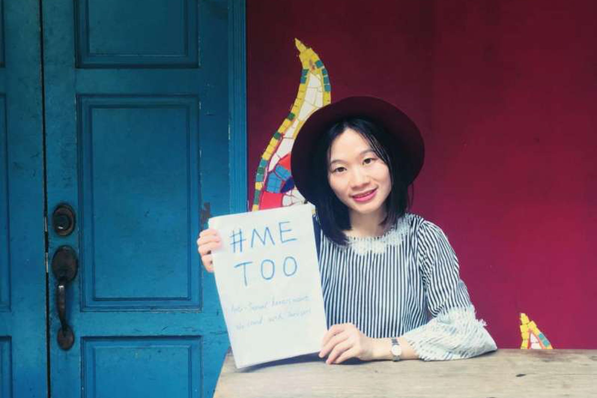 Sophia Huang Xueqin holds up a #MeToo sign in Guangzhou Province.