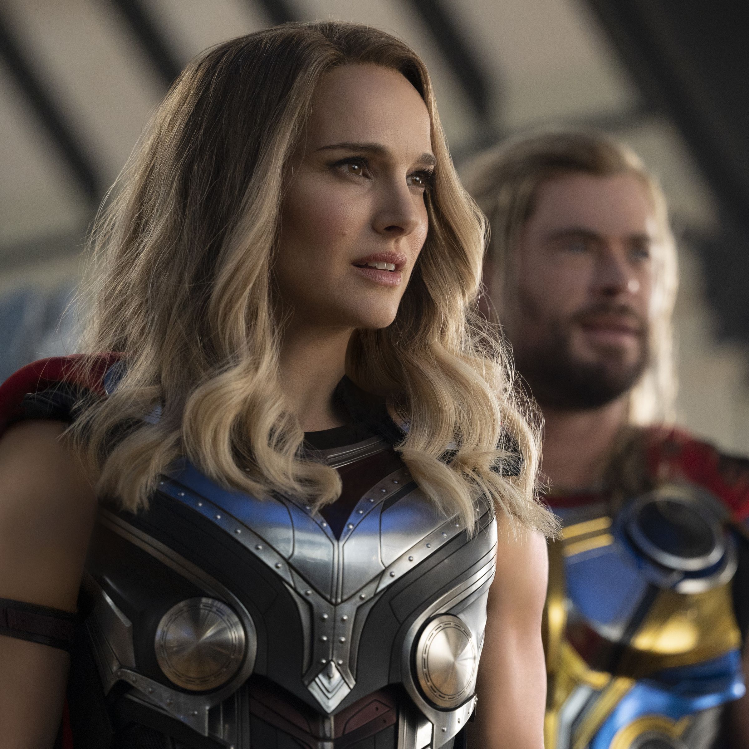 Natalie Portman as Jane Foster, the Mighty Thor, and Chris Hemsworth as Thor Odinson.