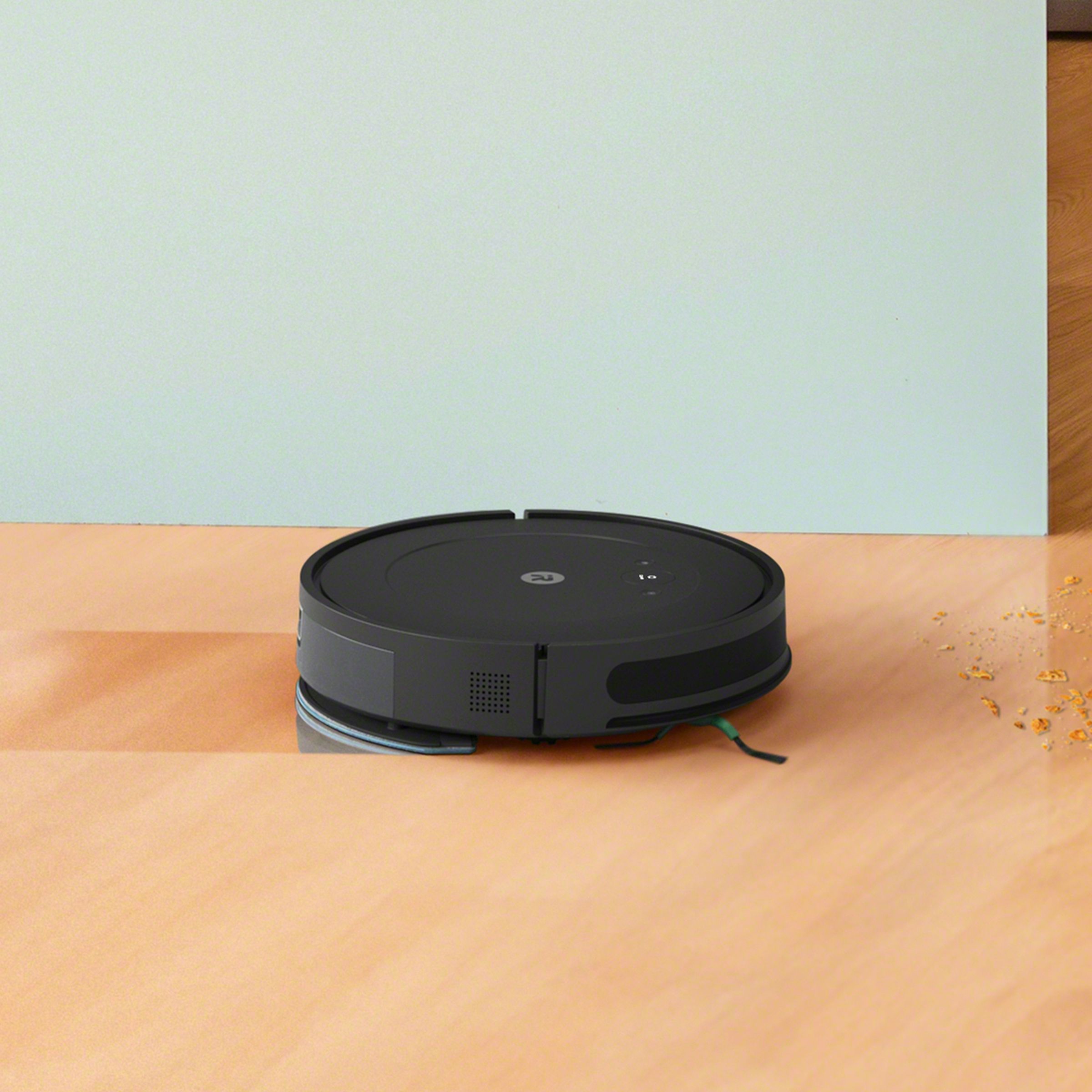 iRobot’s Roomba Combo Essential robot vacuum cleaner on a wooden floor.