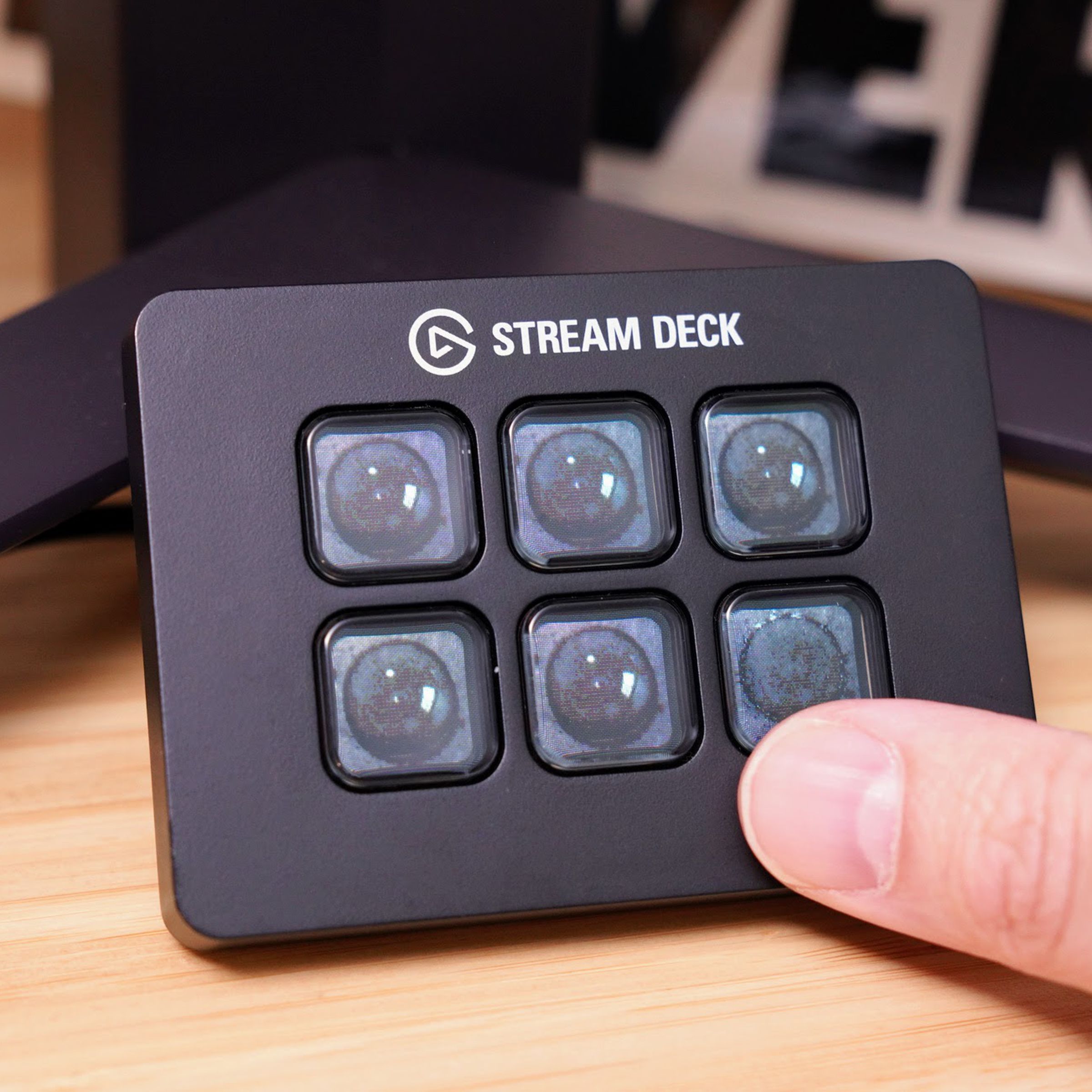 A Stream Deck filled with six LCD keys each filled with bubbles to pop