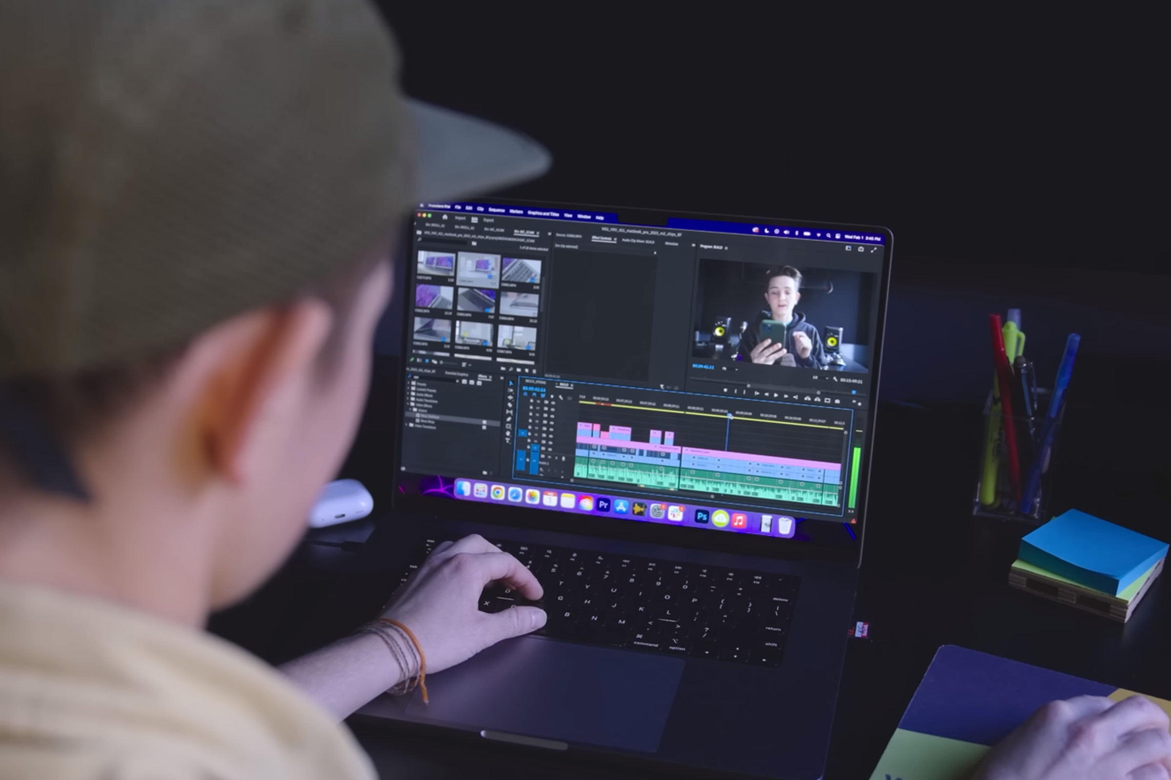 A user edits a video in Premiere Pro on the MacBook Pro 16.