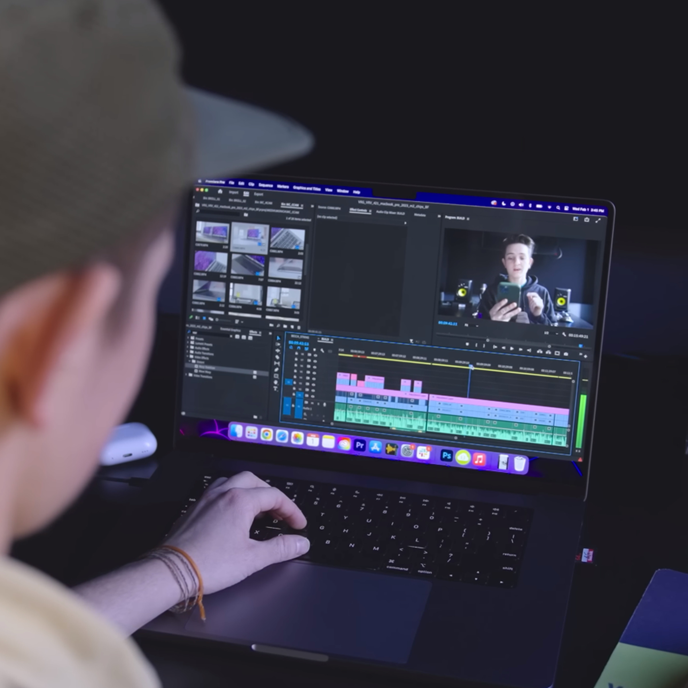 A user edits a video in Premiere Pro on the MacBook Pro 16.