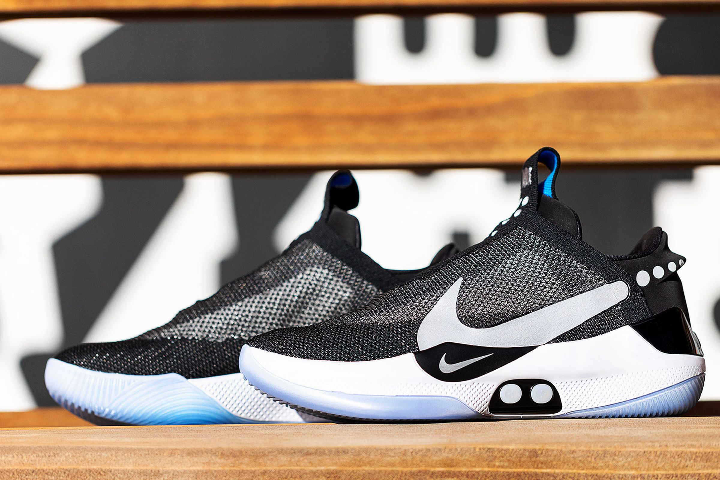 The Nike Adapt BB self-lacing basketball sneakers on a bench.