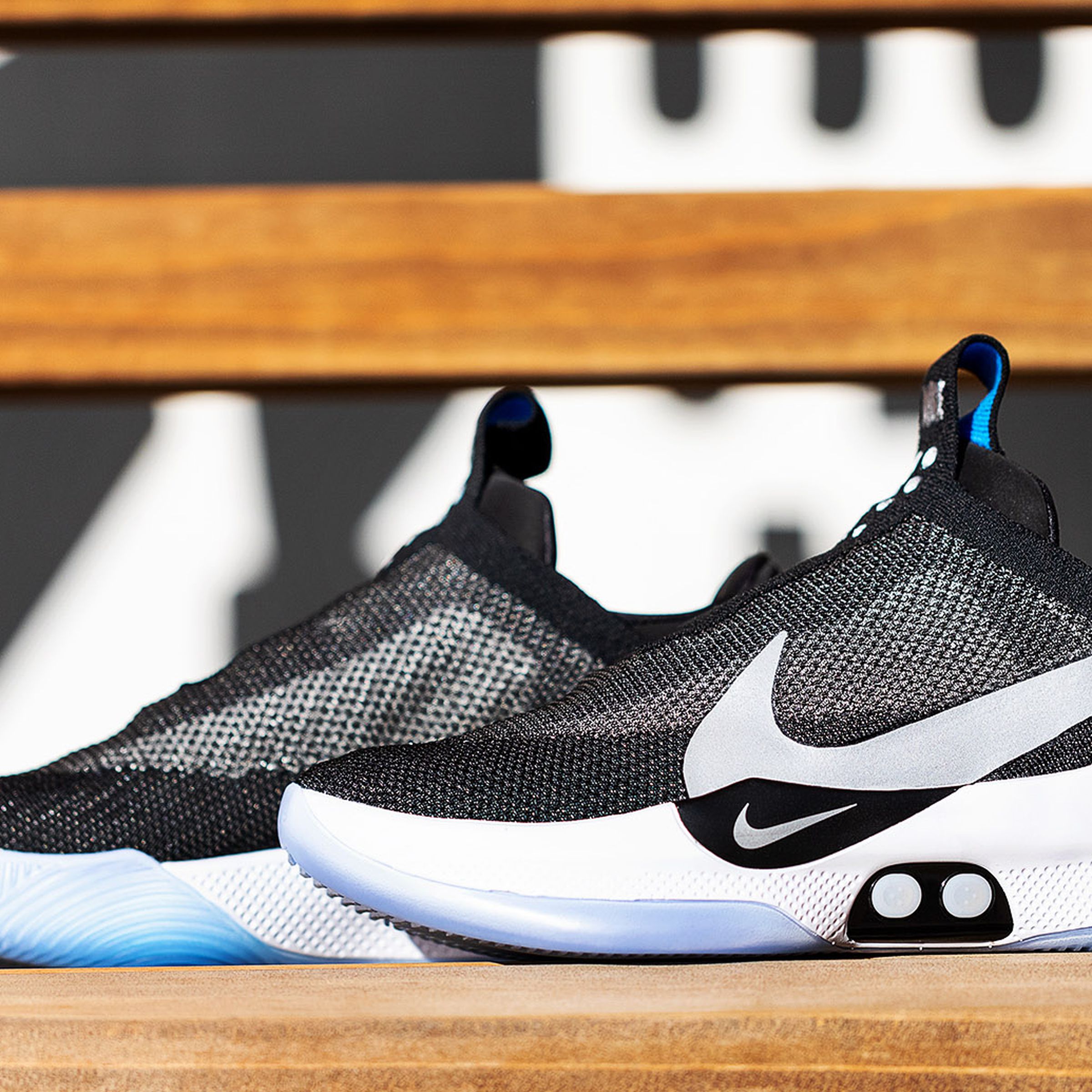 The Nike Adapt BB self-lacing basketball sneakers on a bench.